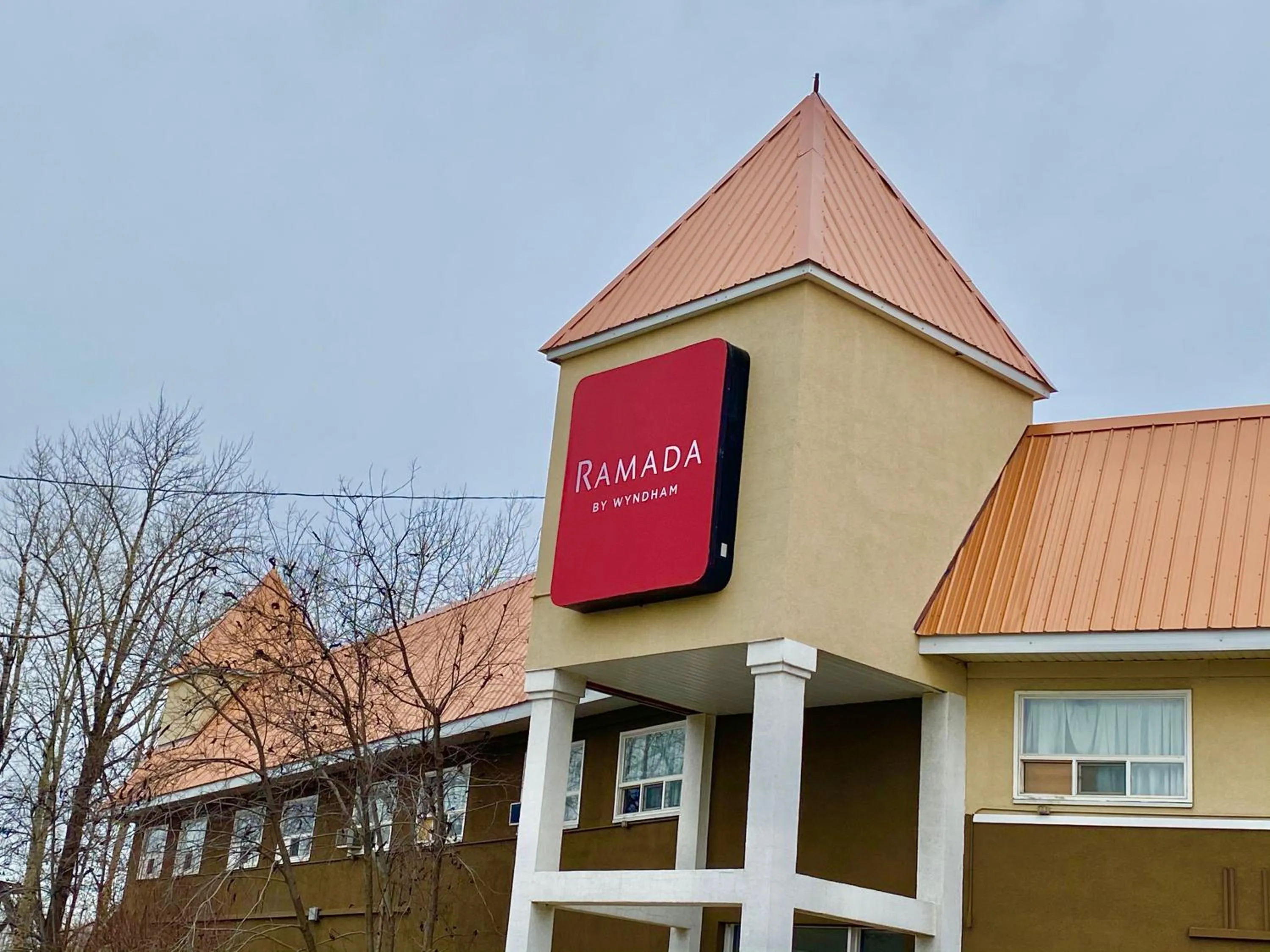 Property logo or sign in Ramada by Wyndham Whitecourt