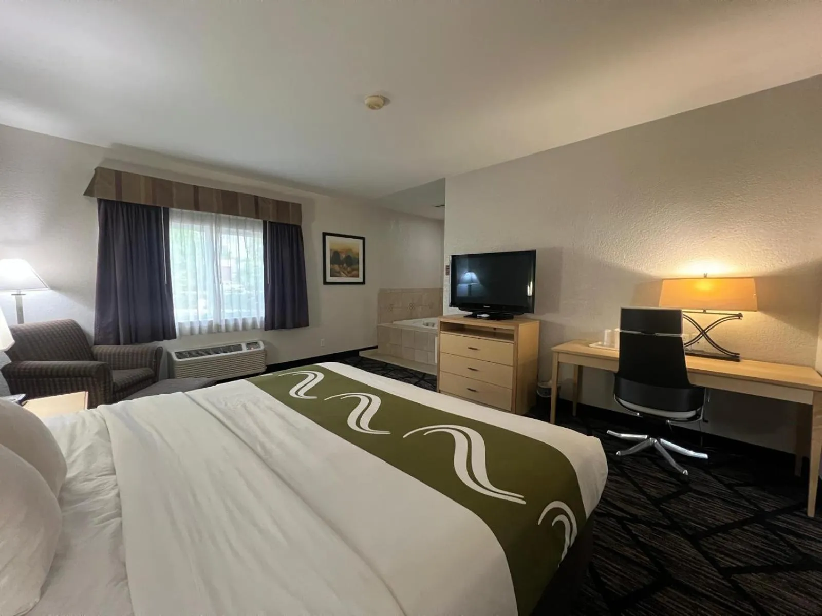 Bed in Quality Inn & Suites Loveland