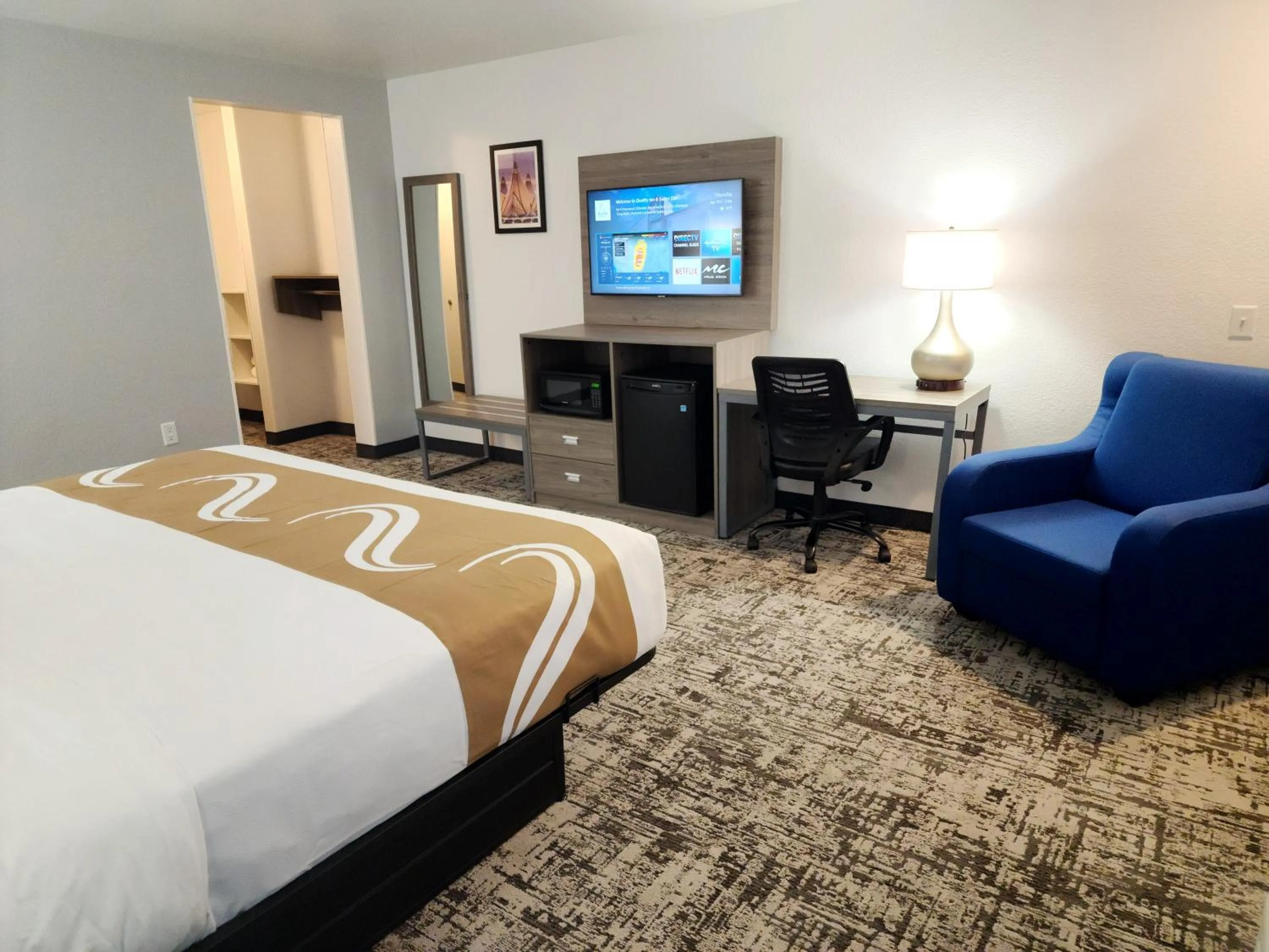Bed in Quality Inn & Suites Denver International Airport