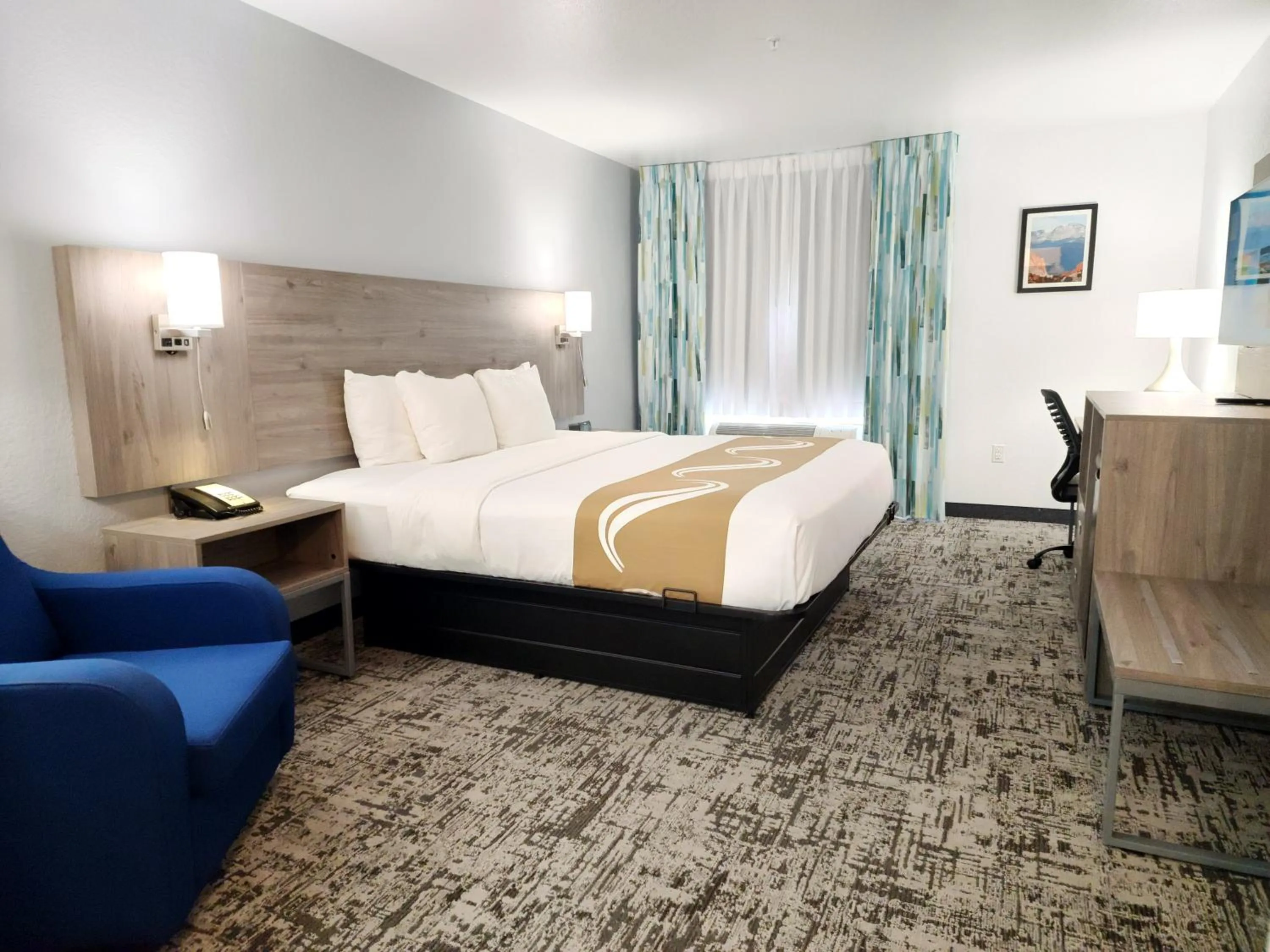 Bed in Quality Inn & Suites Denver International Airport