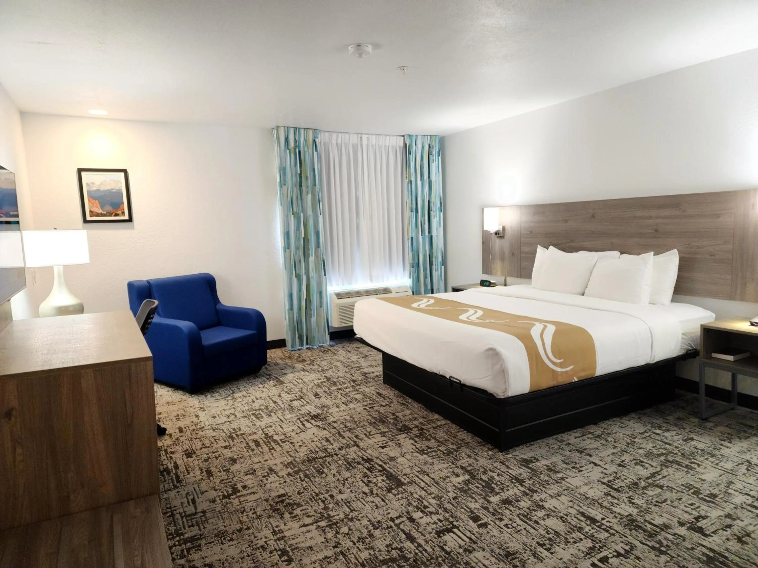 Bed in Quality Inn & Suites Denver International Airport