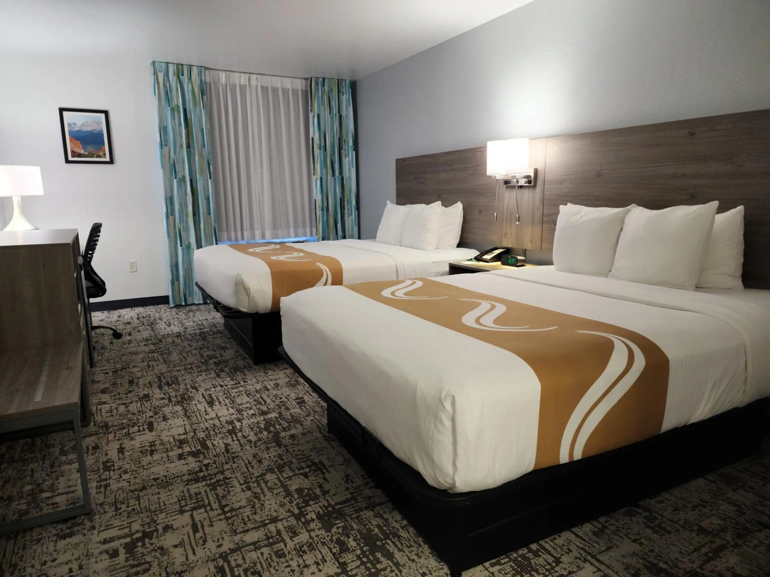 Bed in Quality Inn & Suites Denver International Airport