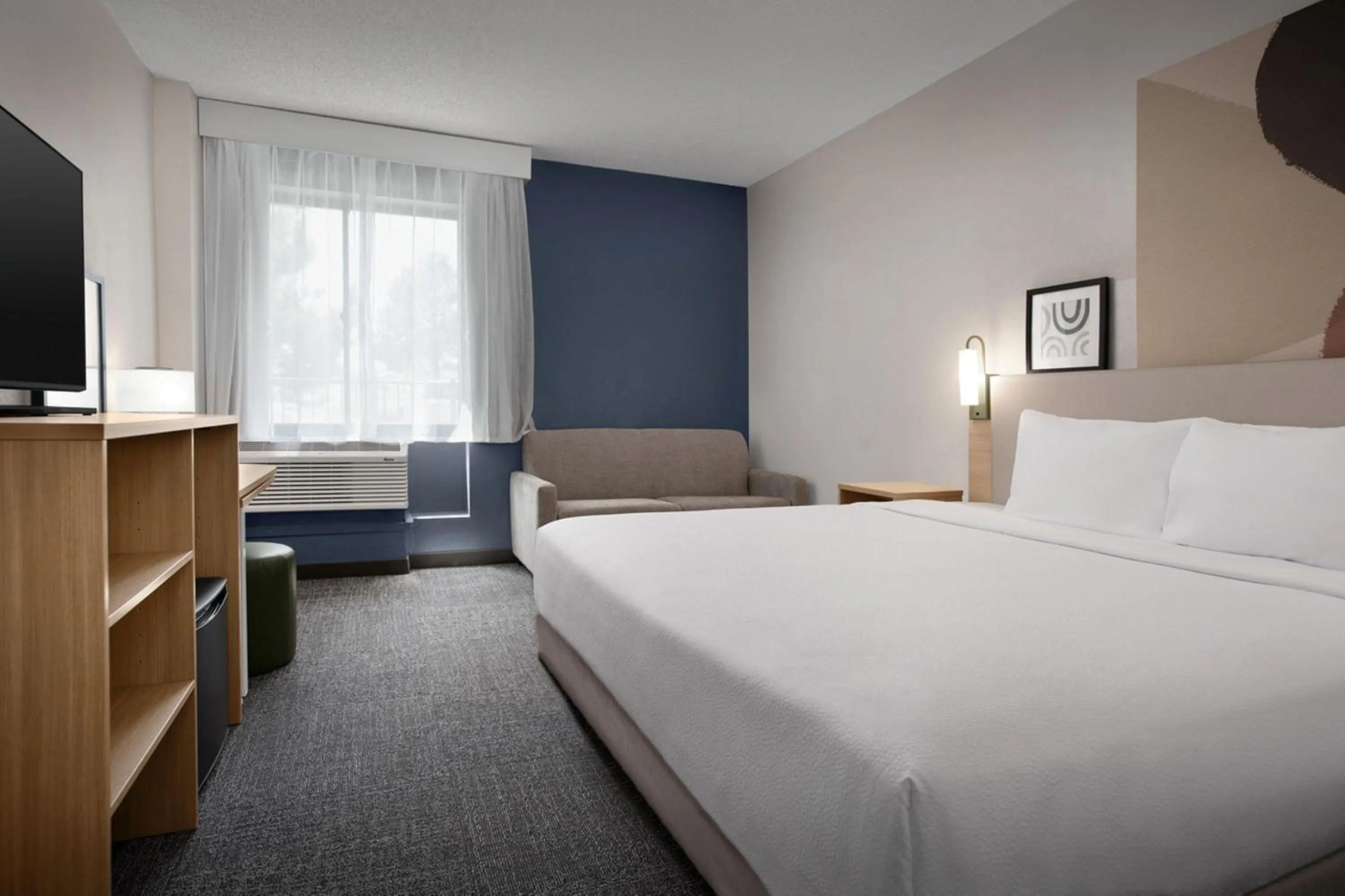 Living room, Bed in Spark by Hilton Lakewood Denver Southwest