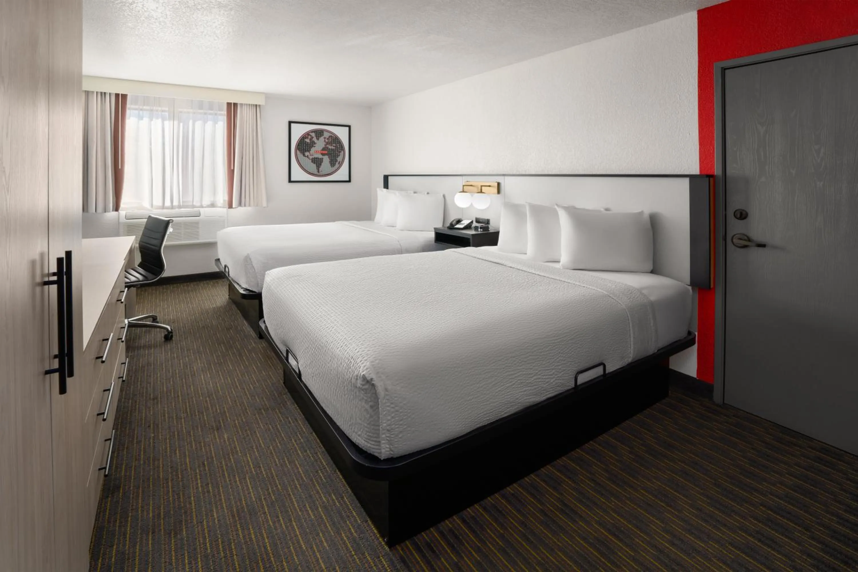Bed in SYLO Hotel Denver Airport, a Ramada by Wyndham