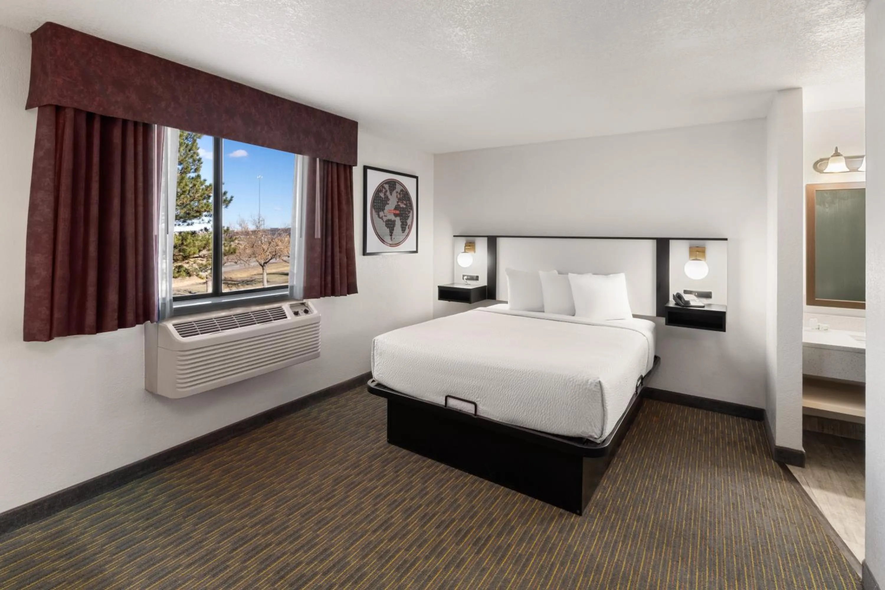 Bed in SYLO Hotel Denver Airport, a Ramada by Wyndham