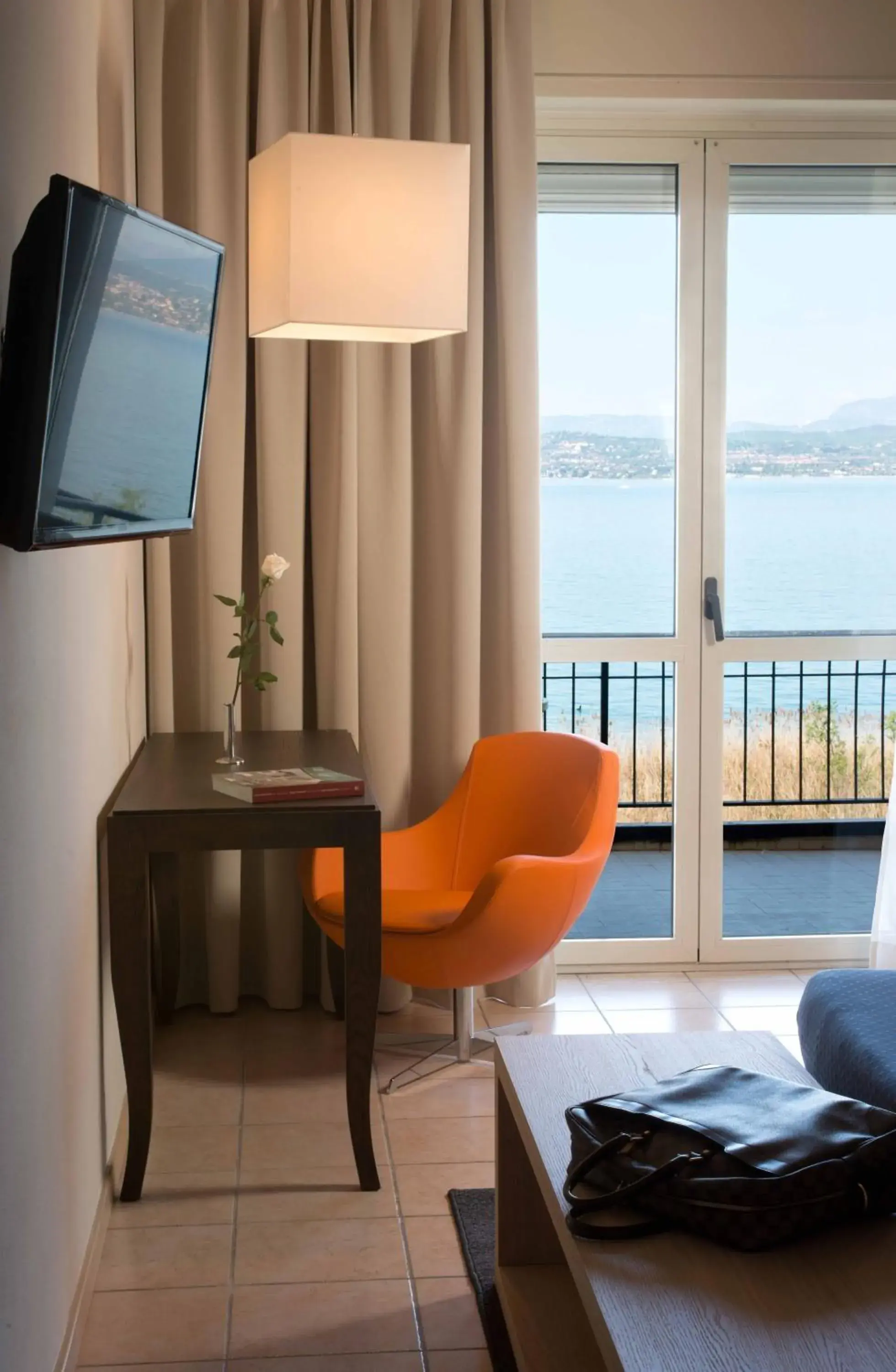 Family Room (2 Adults + 2 Children) Terrace - Lake View in Hotel Miramar Family Room (2 Adults + 2 Children) Terrace - Lake View in Hotel Miramar