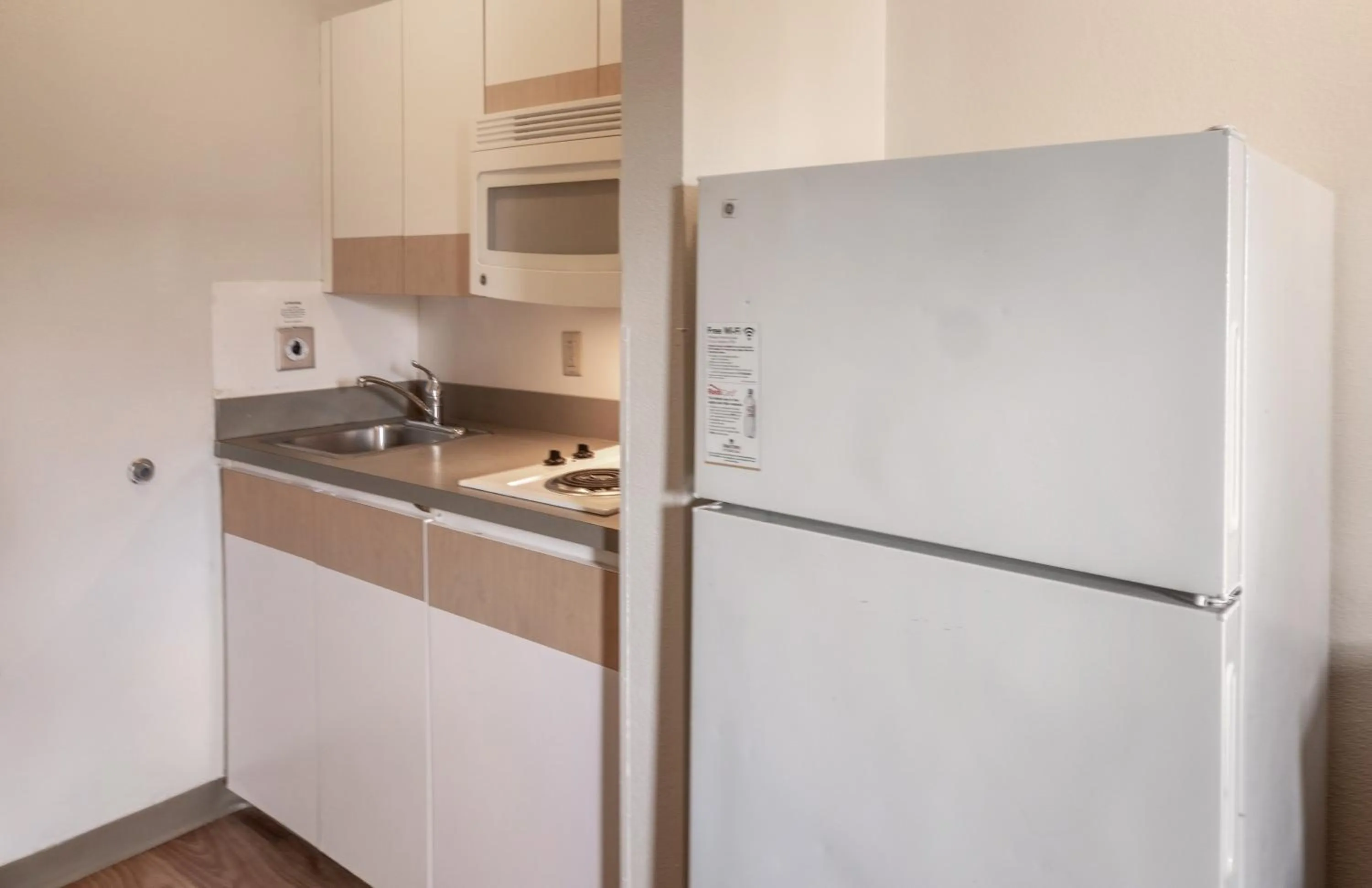 Photo of the whole room in HomeTowne Studios by Red Roof Orlando South