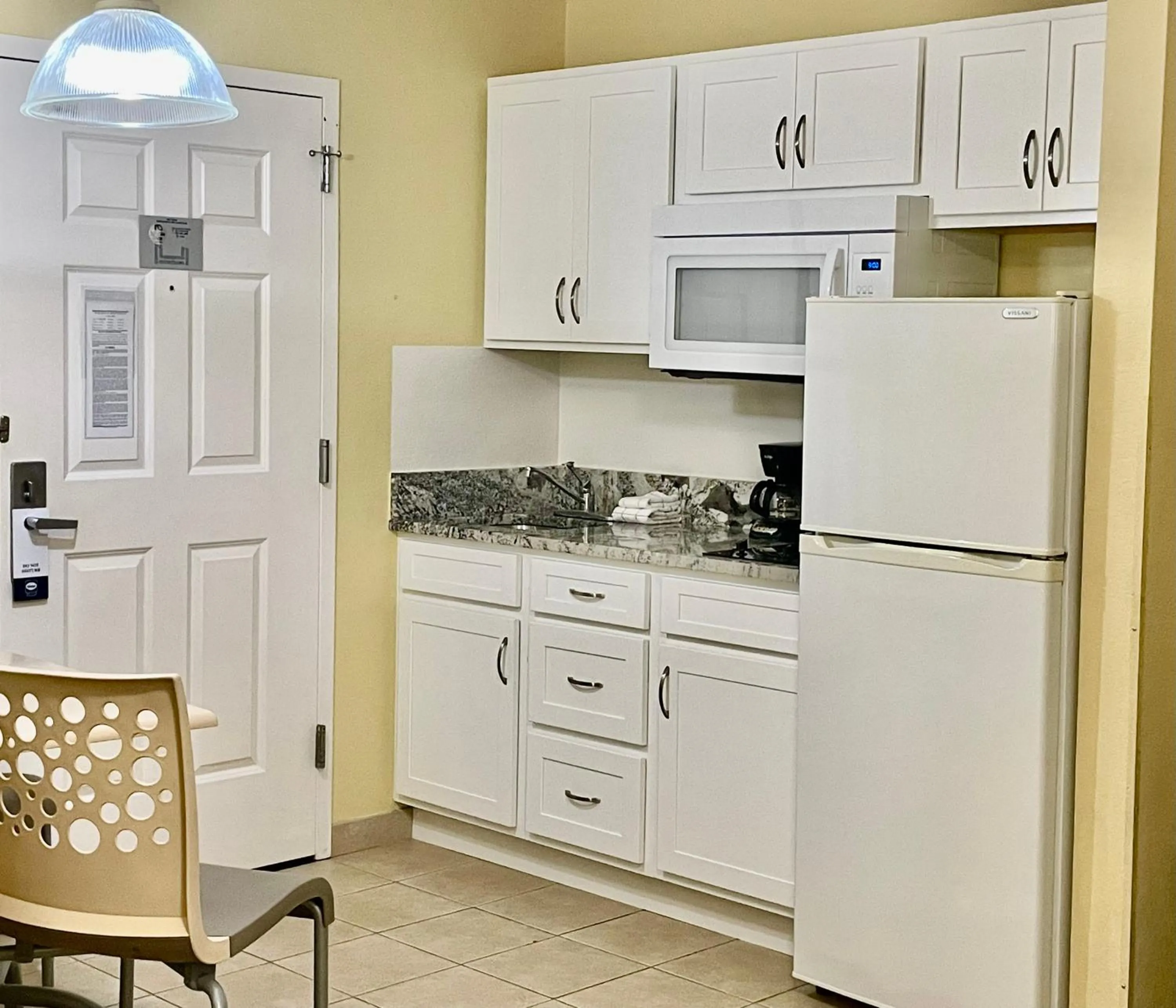 Kitchen or kitchenette in Suburban Studios Fort Myers Cape Coral