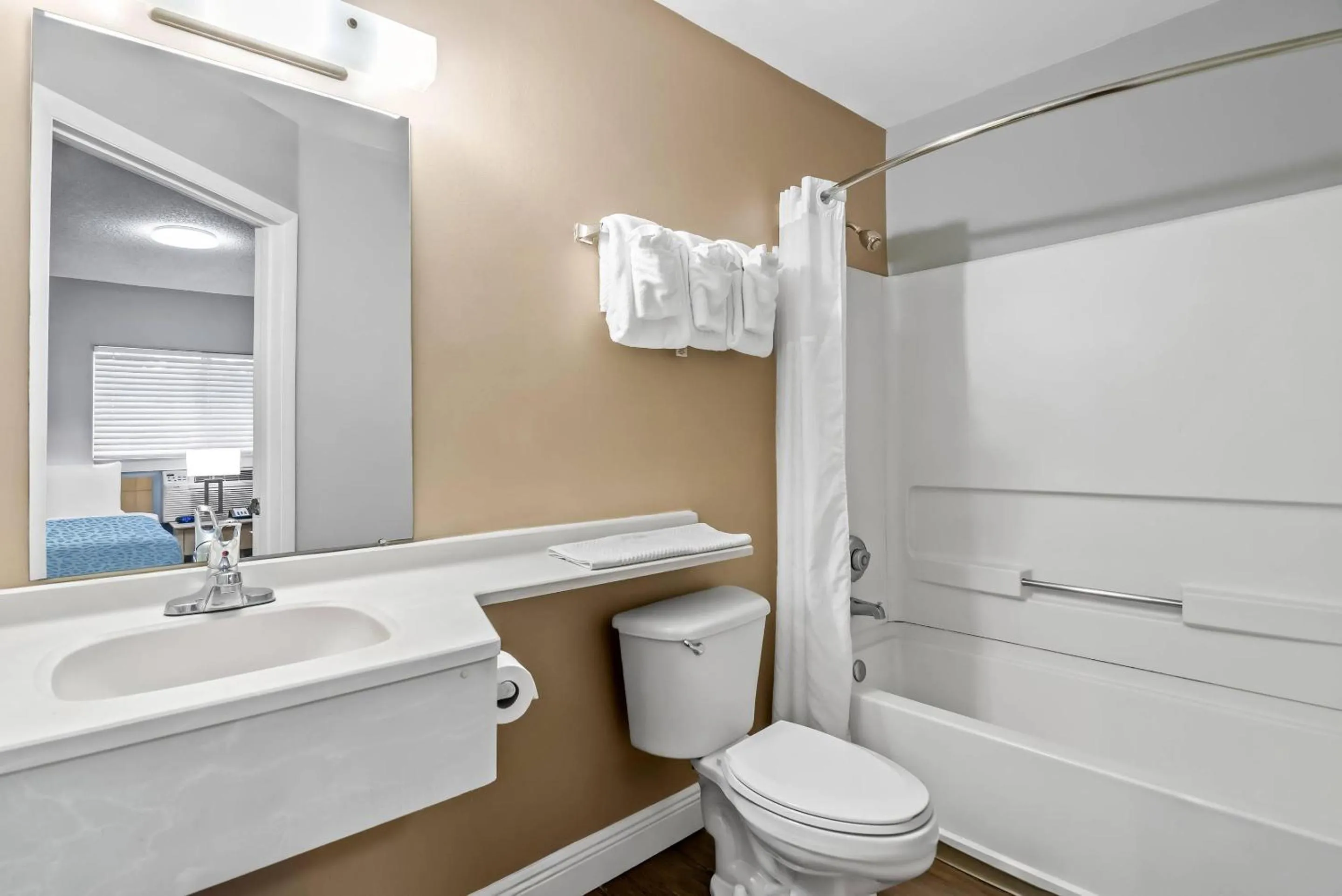 Bedroom in Suburban Studios Stuart near Federal Hwy 1