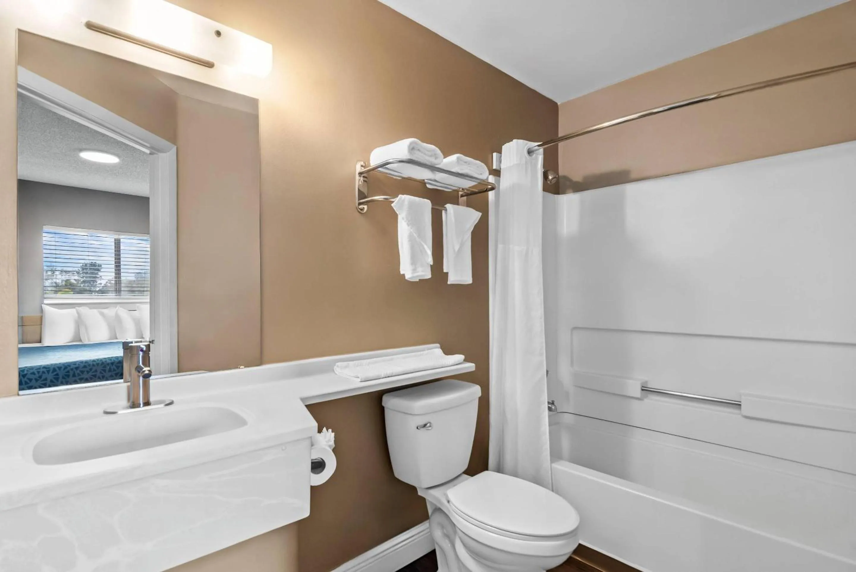 Bedroom in Suburban Studios Stuart near Federal Hwy 1