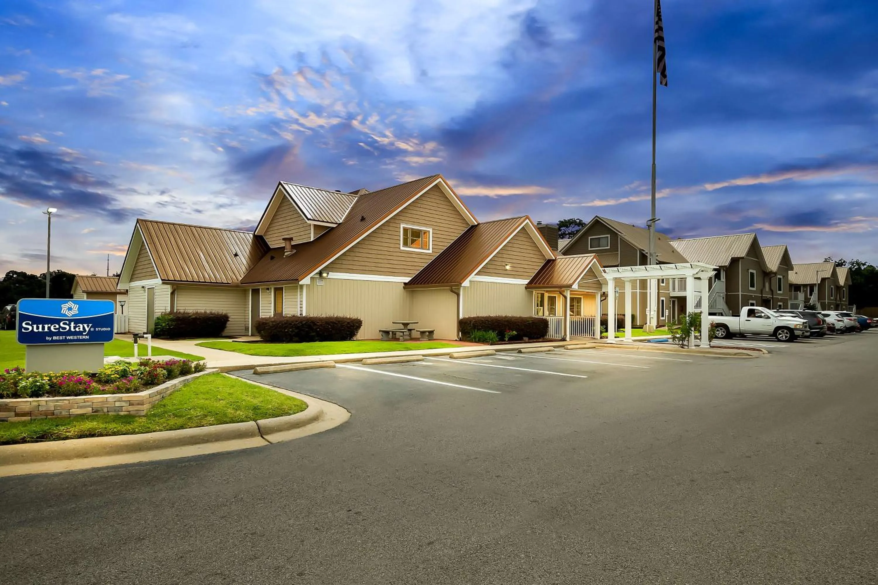 Property building in SureStay Studio by Best Western Pensacola