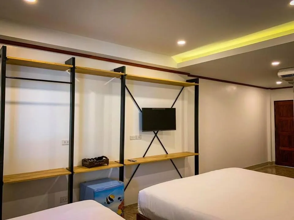 Bed in Coconut Grove Hotel Samui