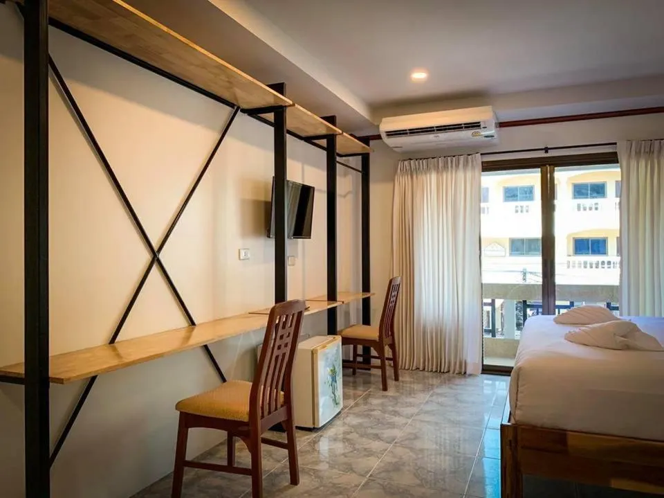 Bed in Coconut Grove Hotel Samui