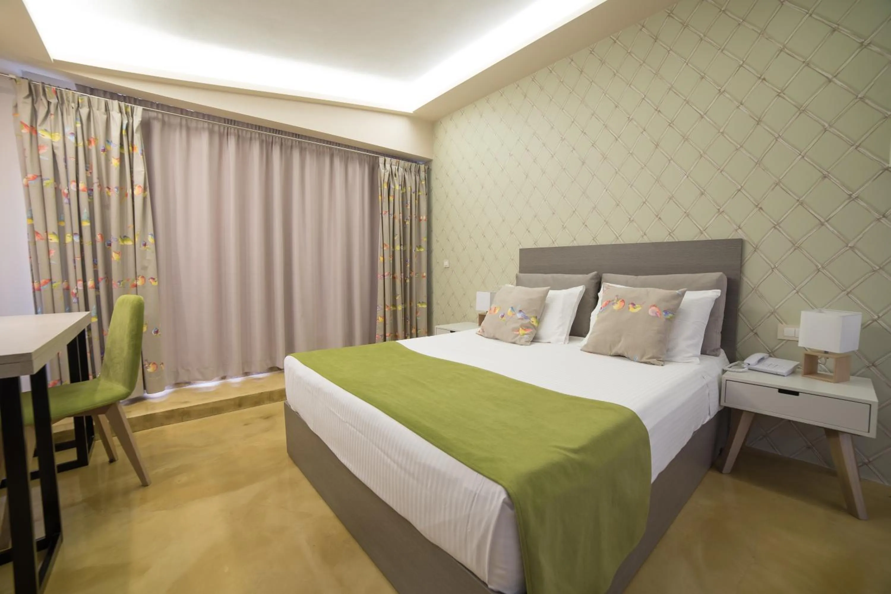 Bed in Koukounaria Hotel & Suites