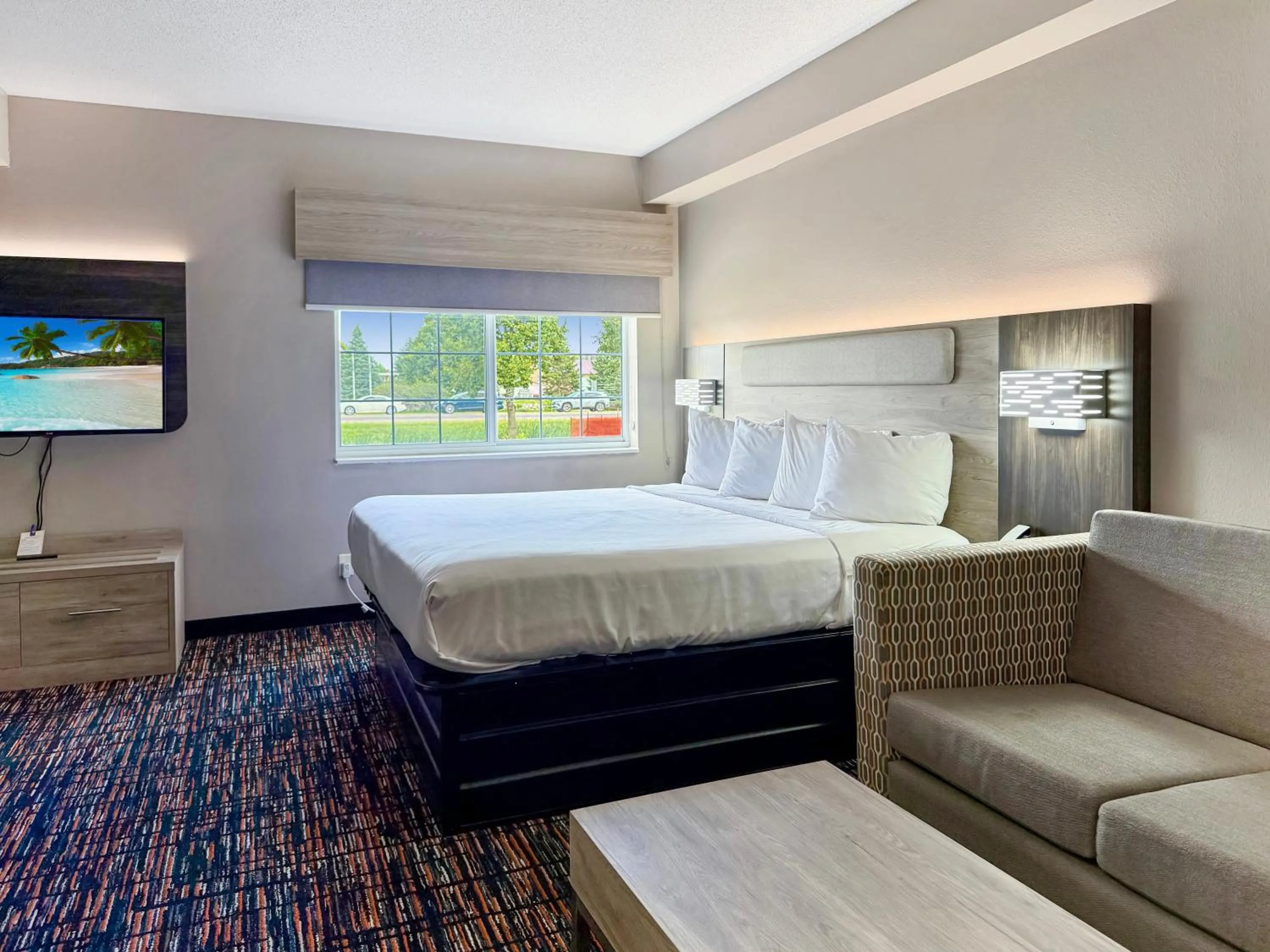 Bed in Reston Inn & Suites