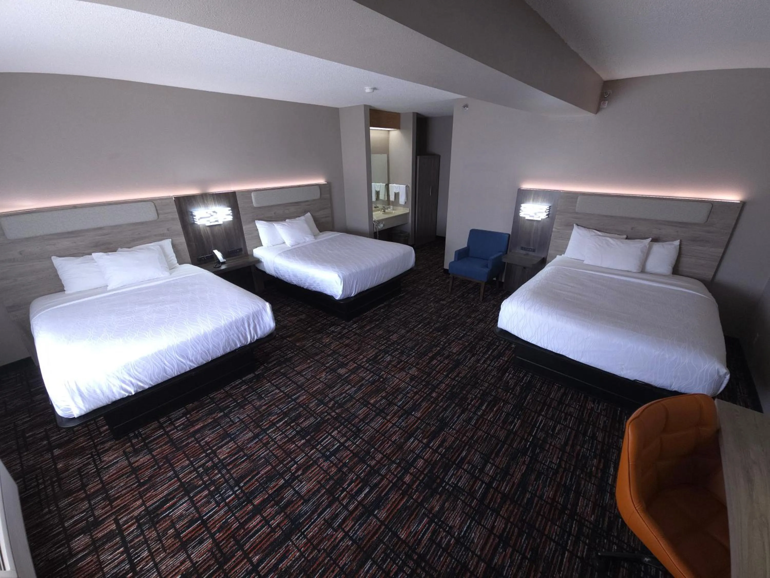 Bed in Reston Inn & Suites