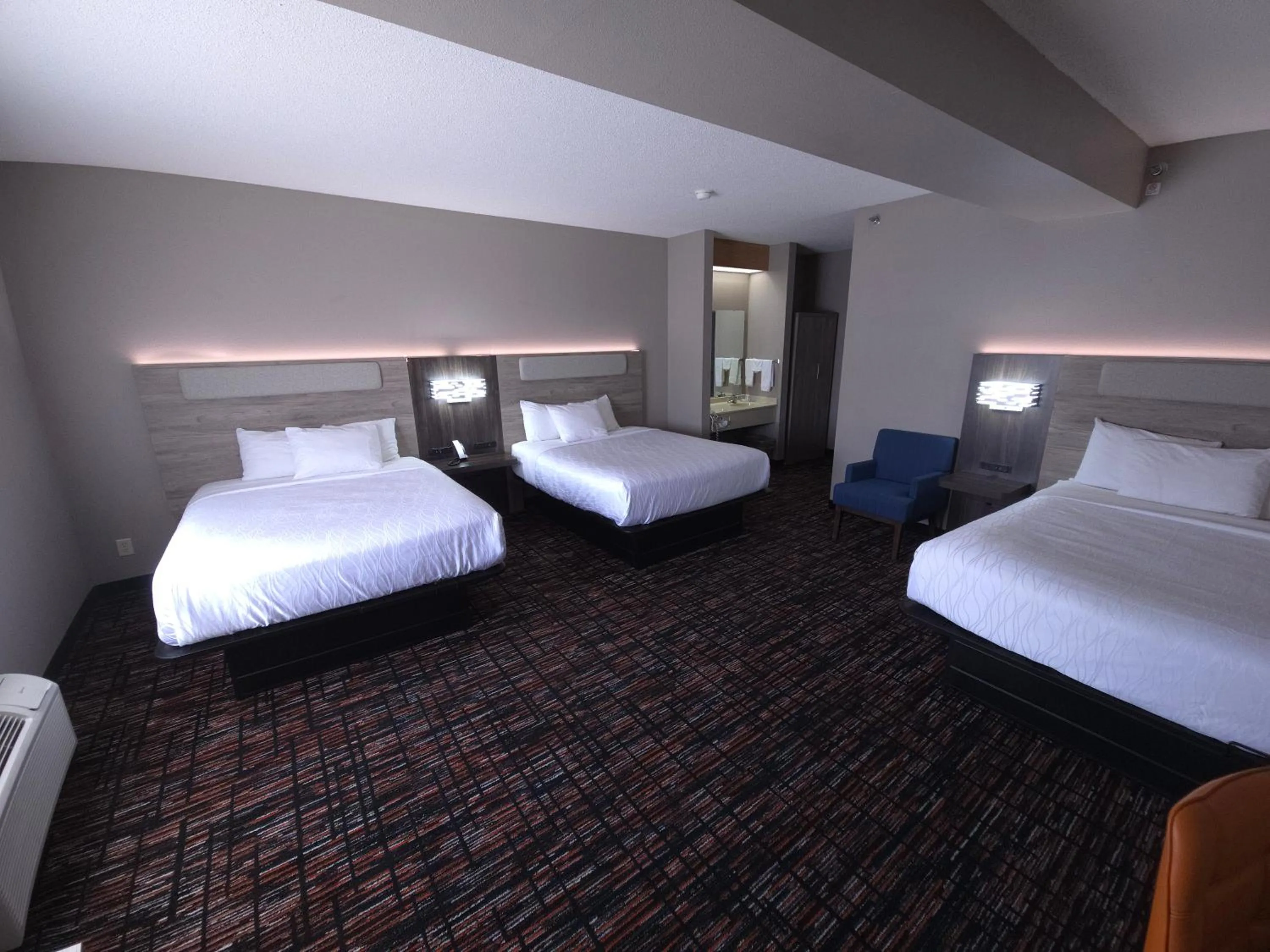 Bed in Reston Inn & Suites