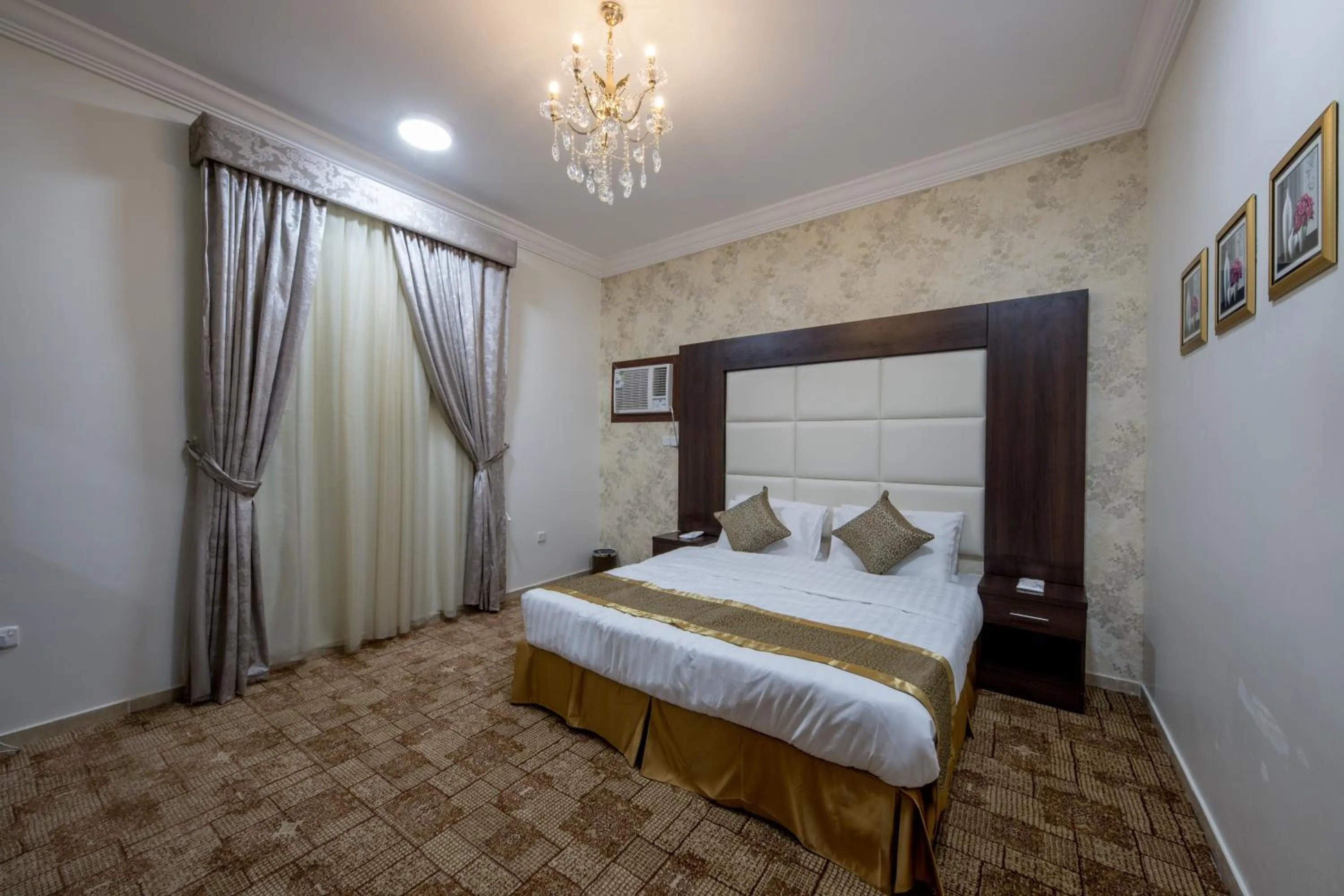 Bed in Jasmine Beach Hotel Suites