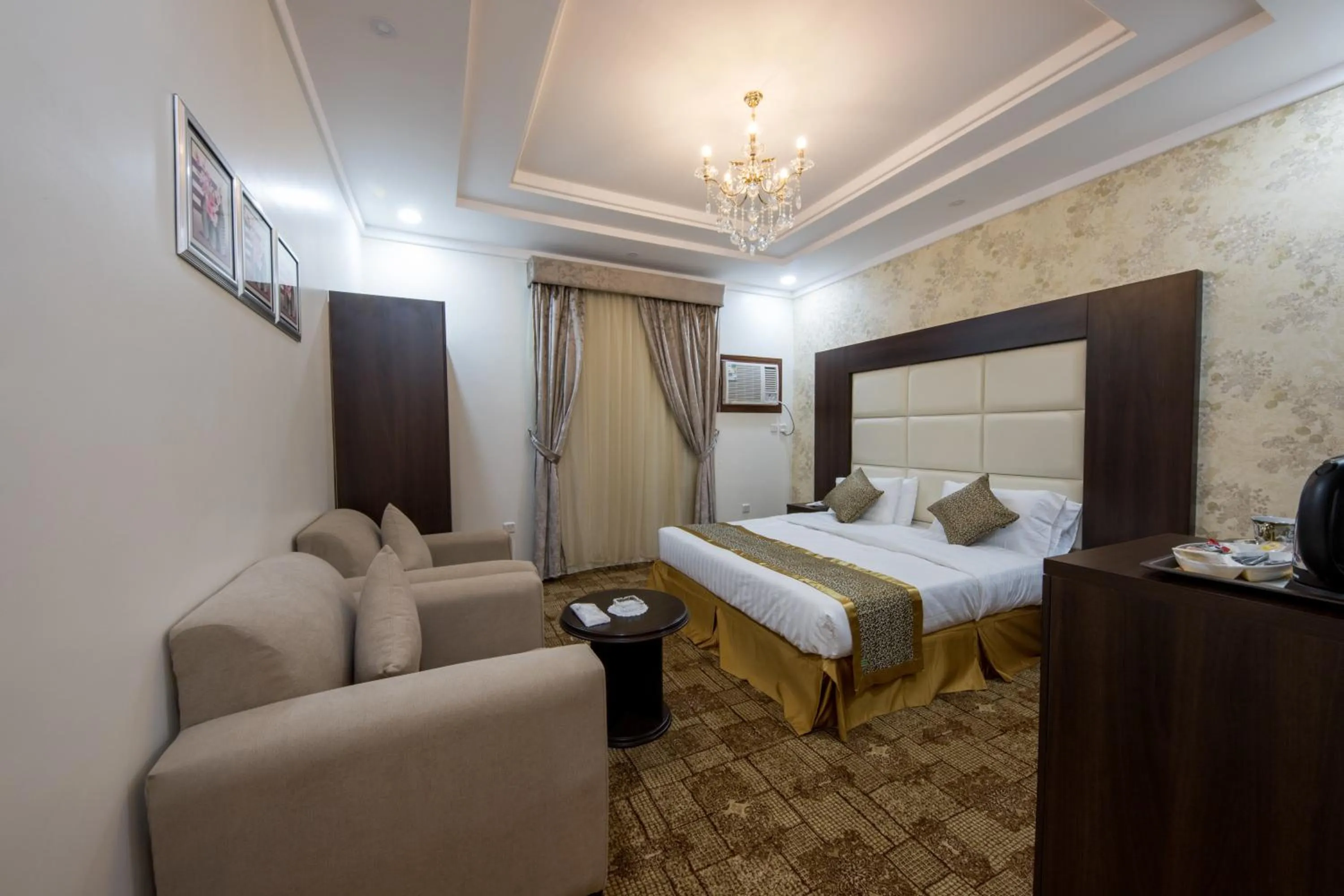 Bed in Jasmine Beach Hotel Suites