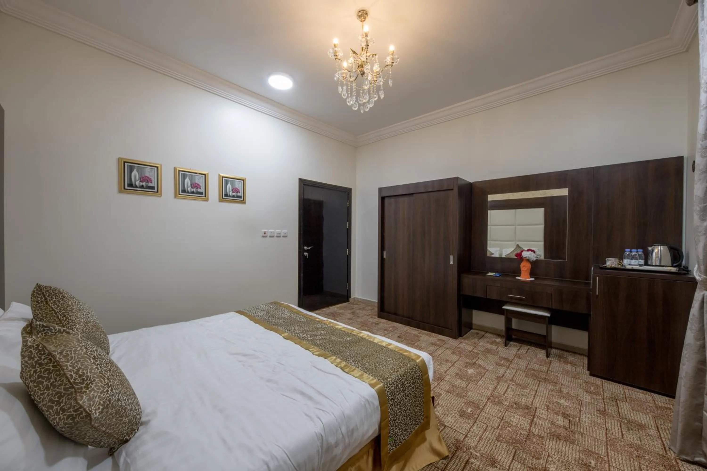 Bed in Jasmine Beach Hotel Suites