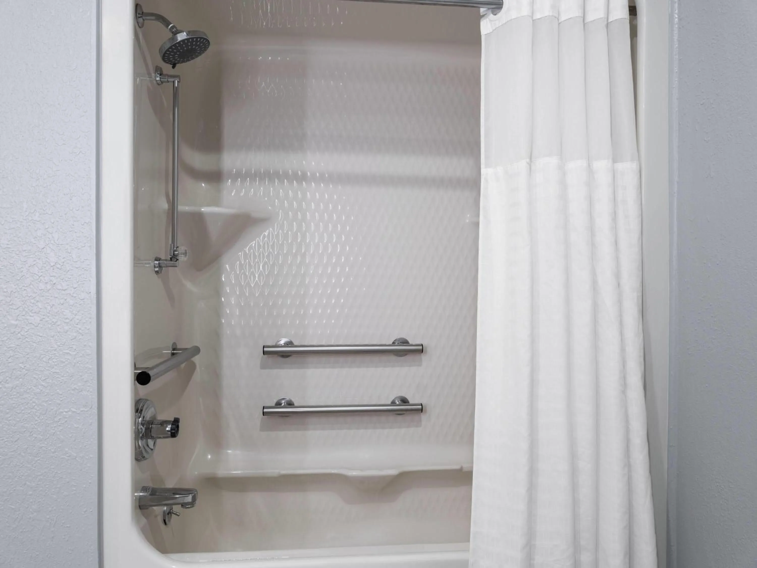 Bathroom in AmericInn by Wyndham Urbana Champaign University Area