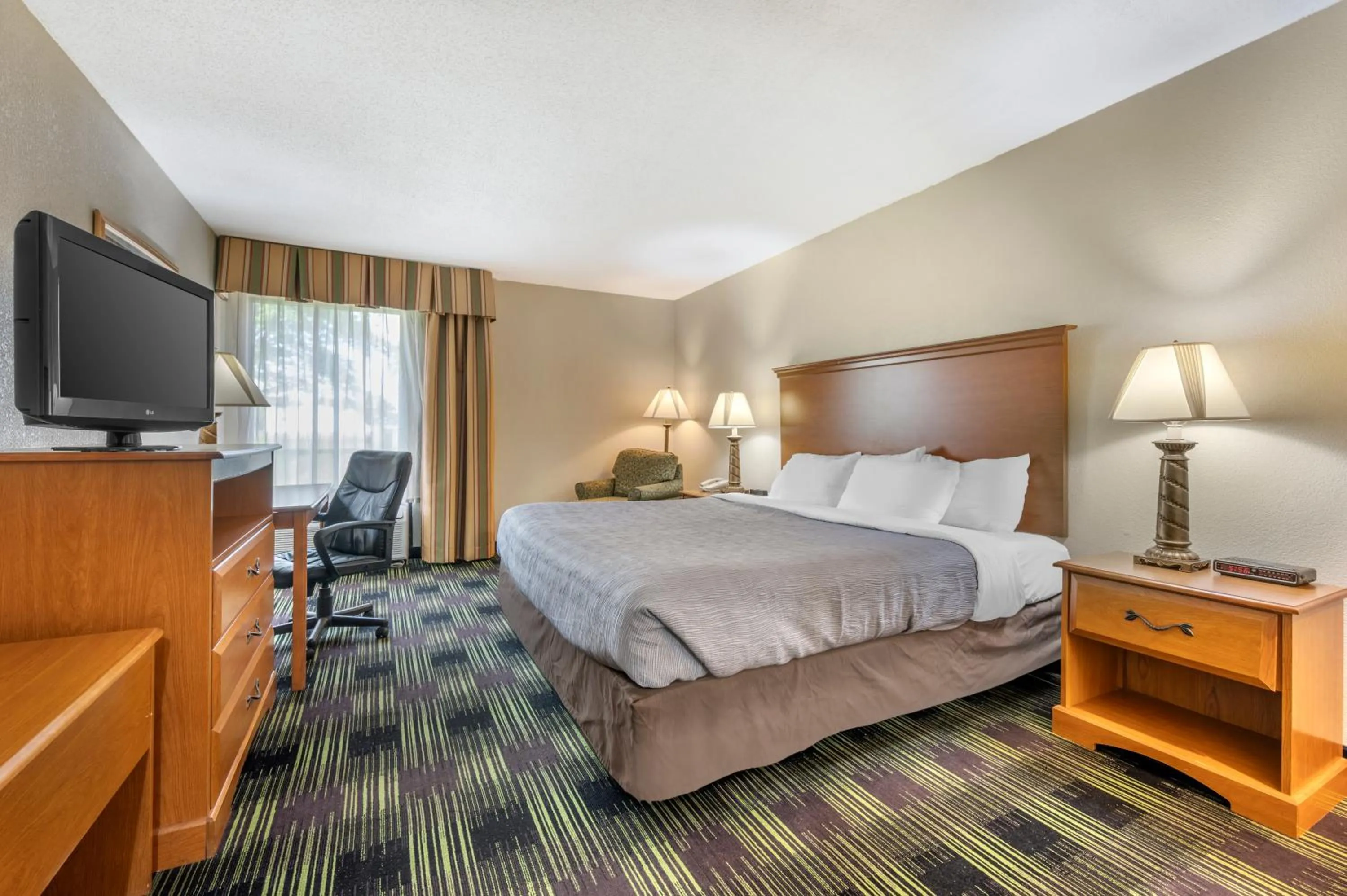 Bed in Quality Inn & Suites Near Amish Country