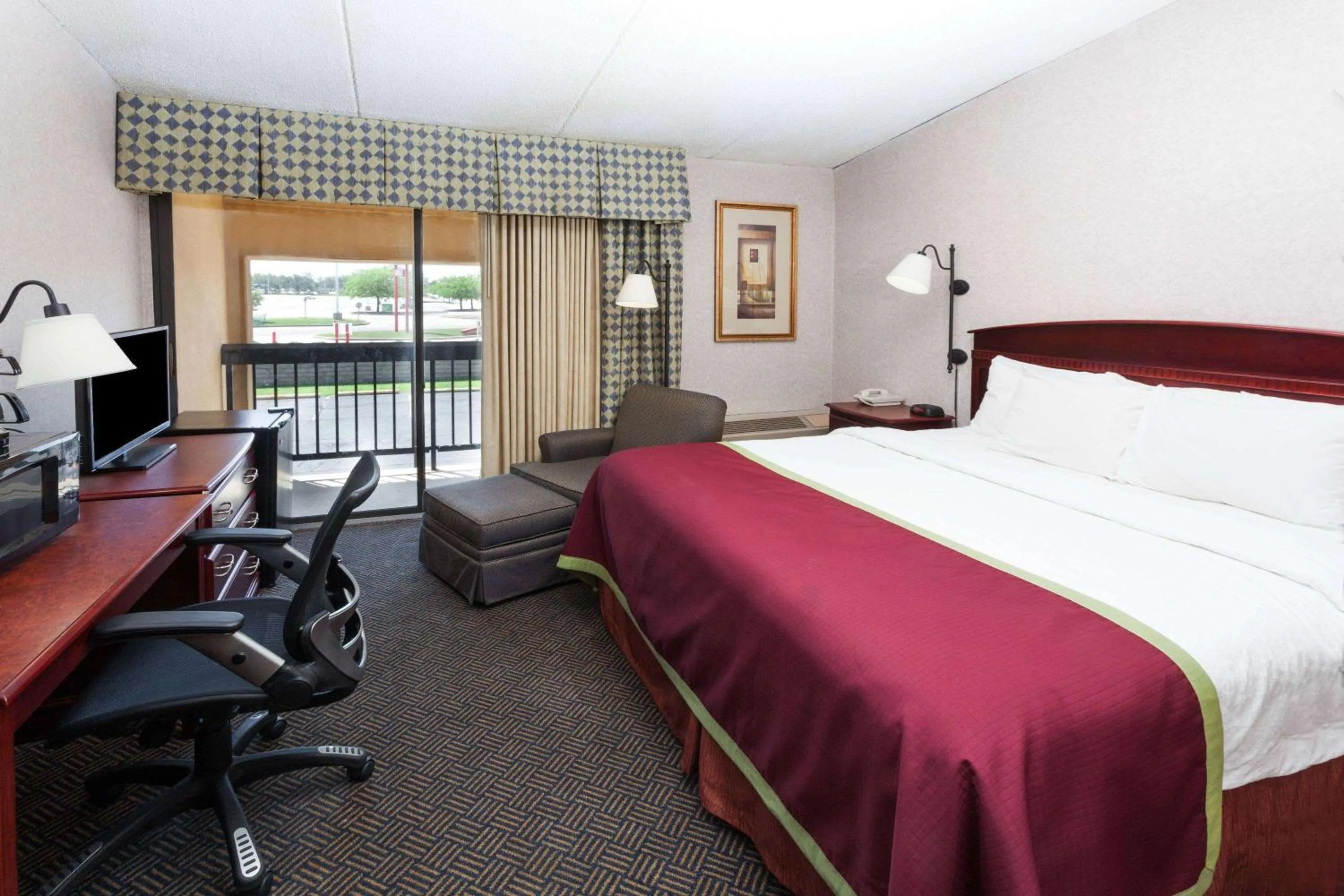 Photo of the whole room, Bed in Baymont by Wyndham Michigan City