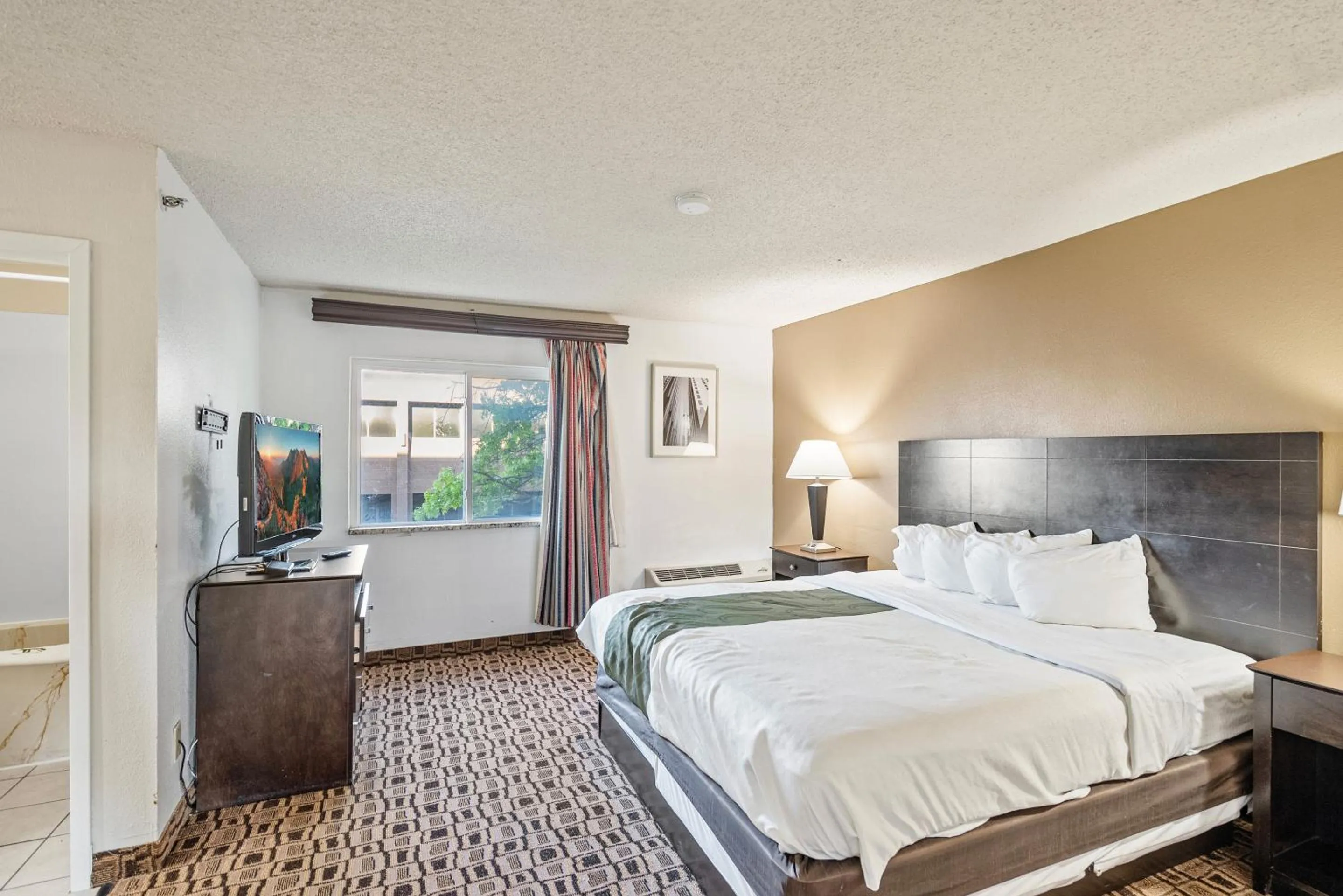 Bedroom, Bed in Coratel Plus Suites Wichita West Airport