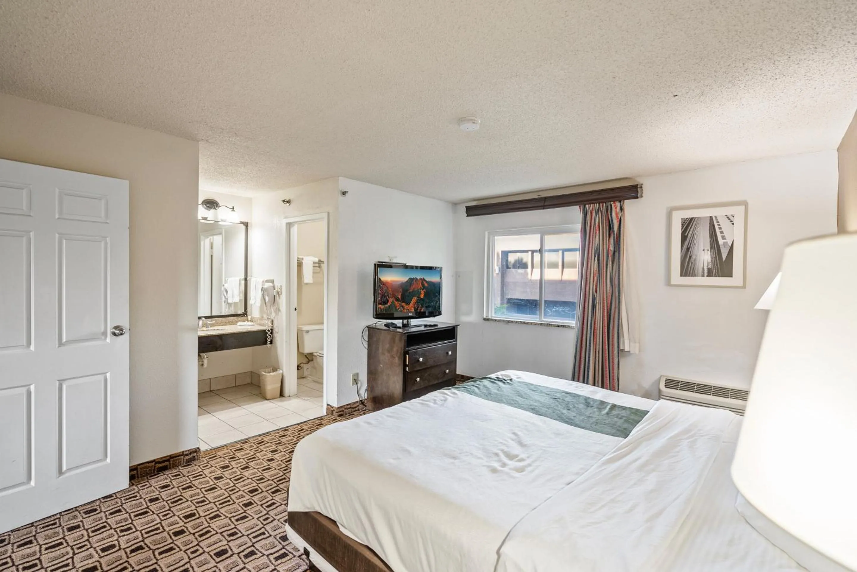 Bedroom, Bed in Coratel Plus Suites Wichita West Airport