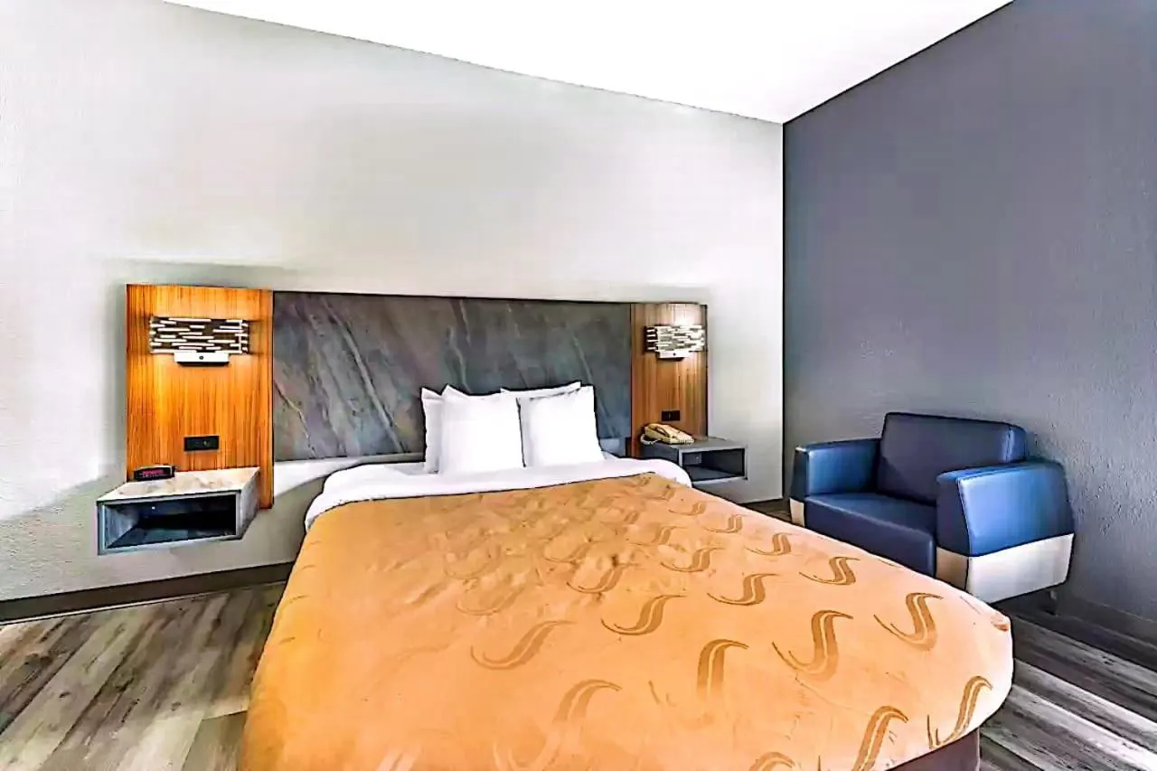 Bed in Quality Inn & Suites Manhattan