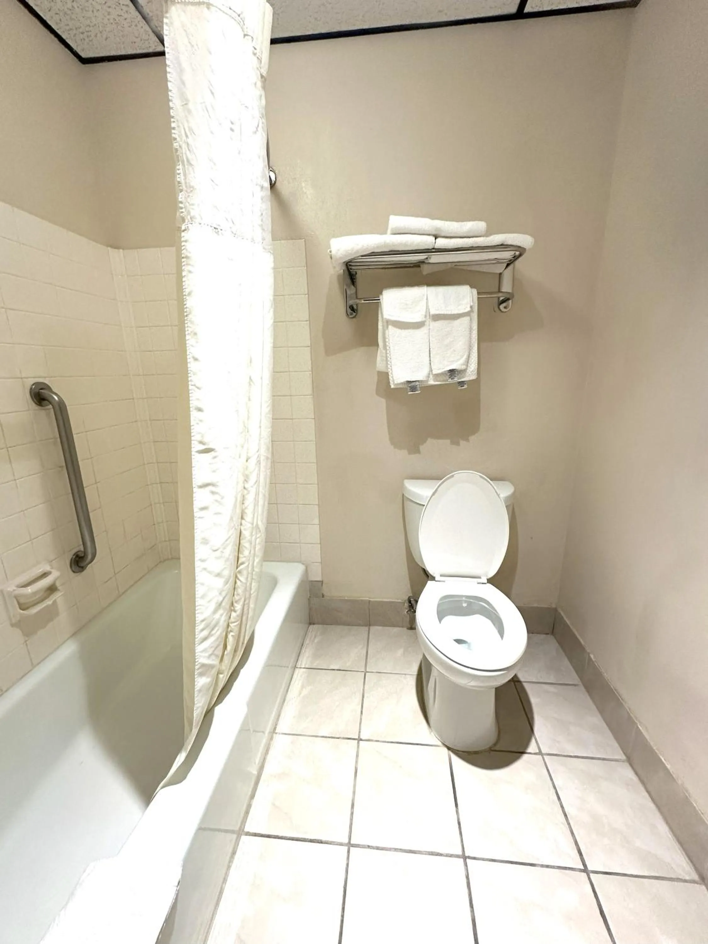 Toilet in Sunflower Inn & Suites
