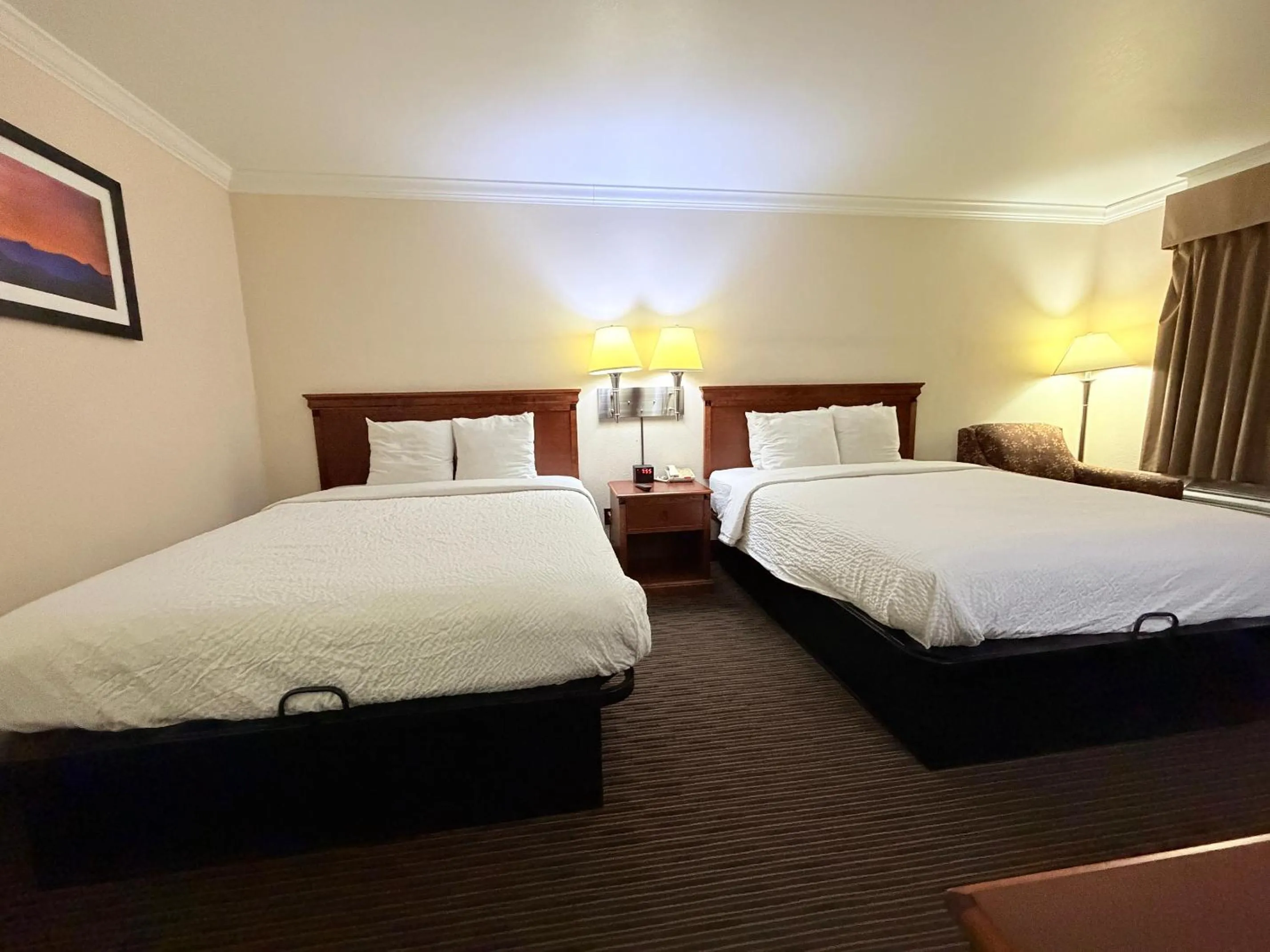 Bedroom, Bed in Sunflower Inn & Suites