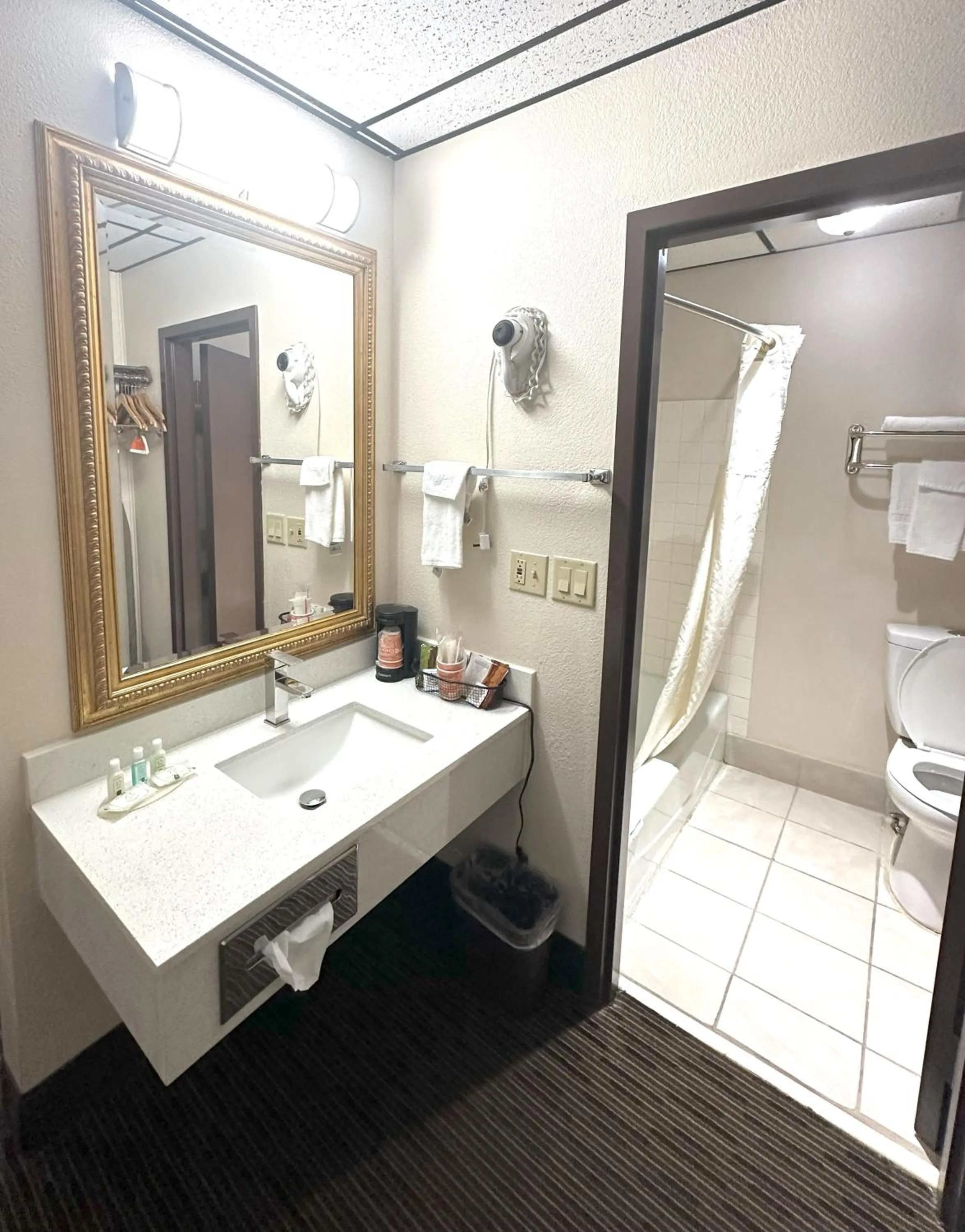 Bathroom, Bed in Sunflower Inn & Suites