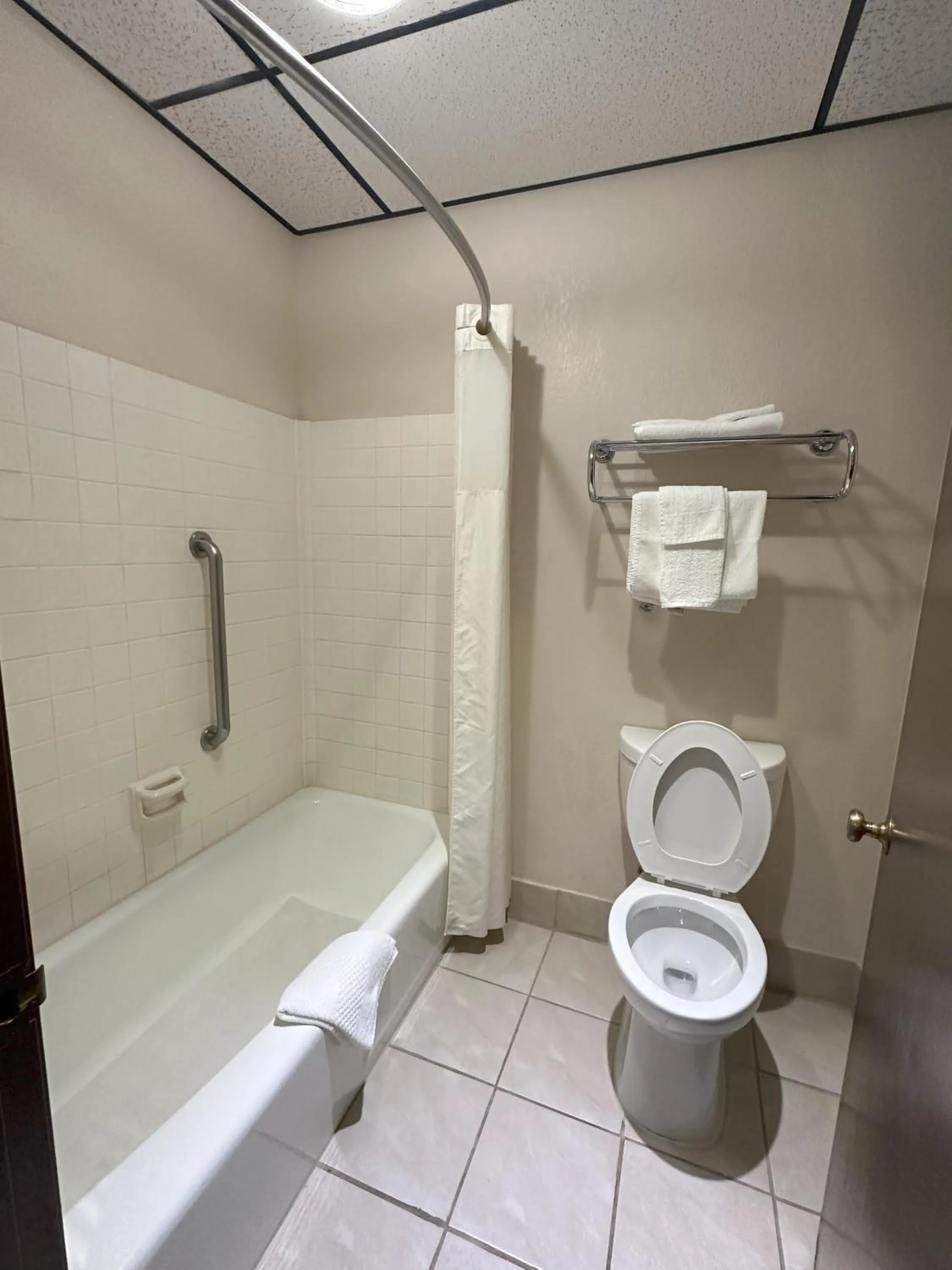 Toilet in Sunflower Inn & Suites