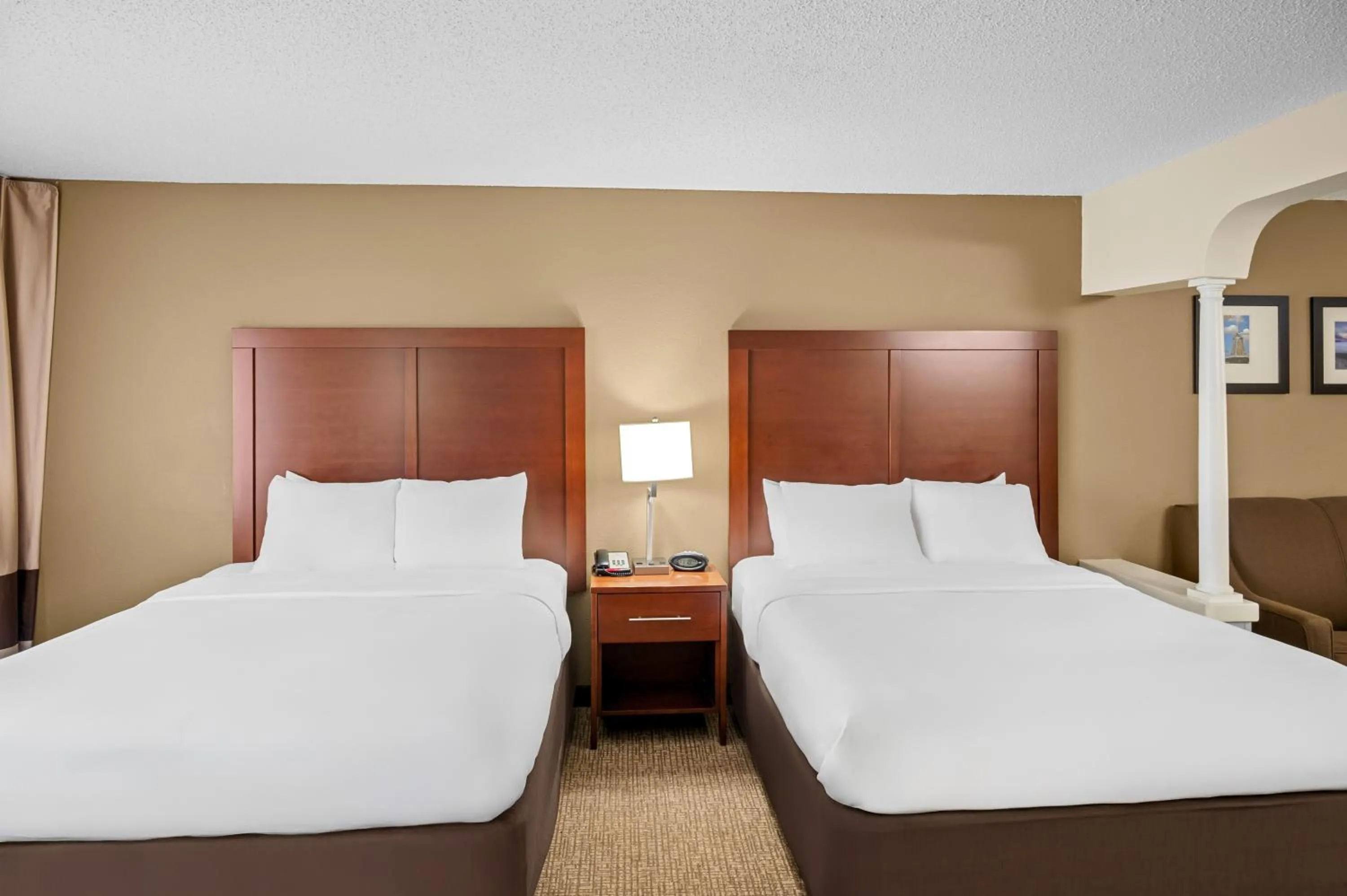 Bed in Comfort Suites Grandville - Grand Rapids SW