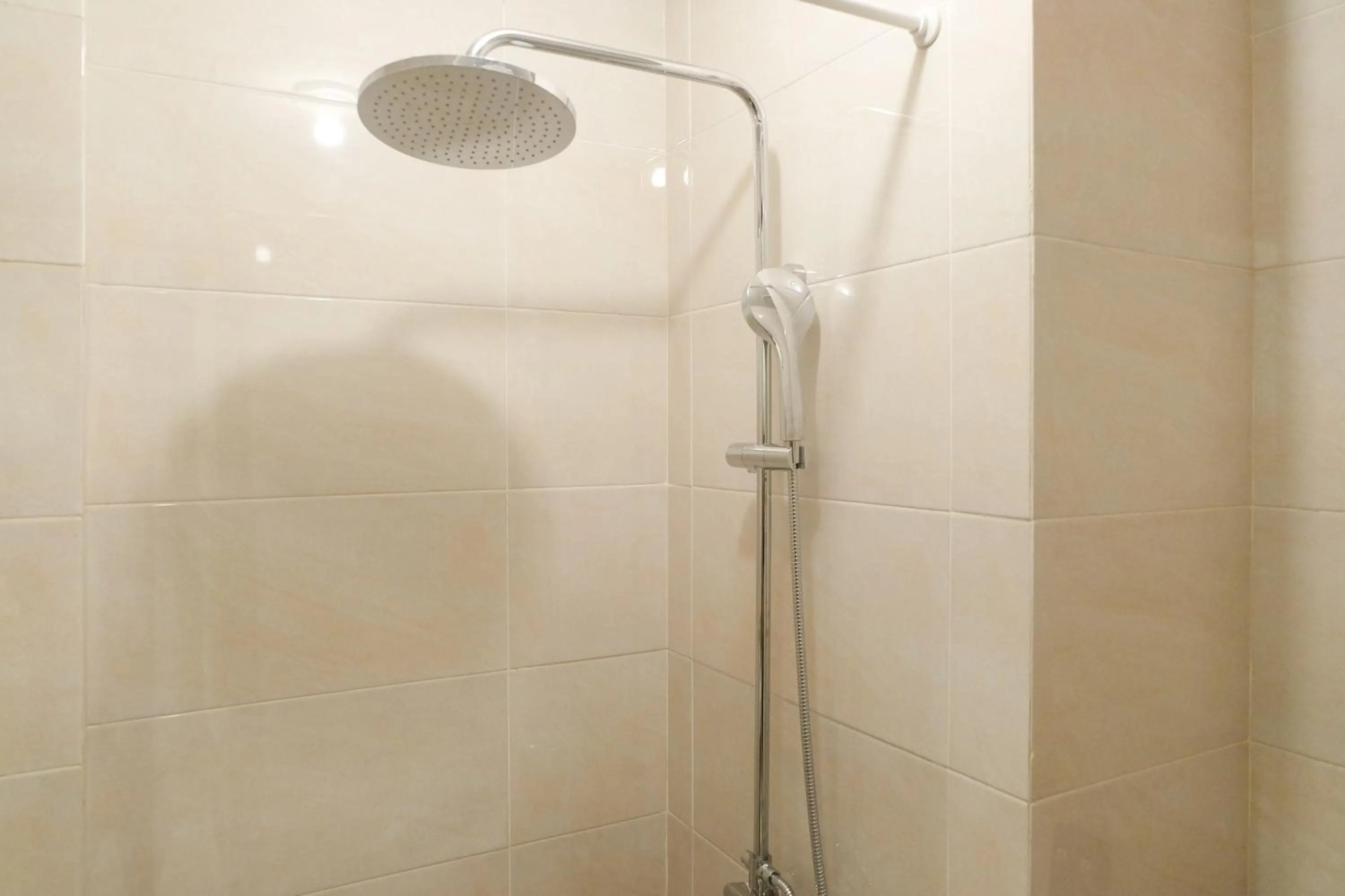 Bathroom in Modern Apartment Studio No Kitchen Mustika Golf Residence By Travelio