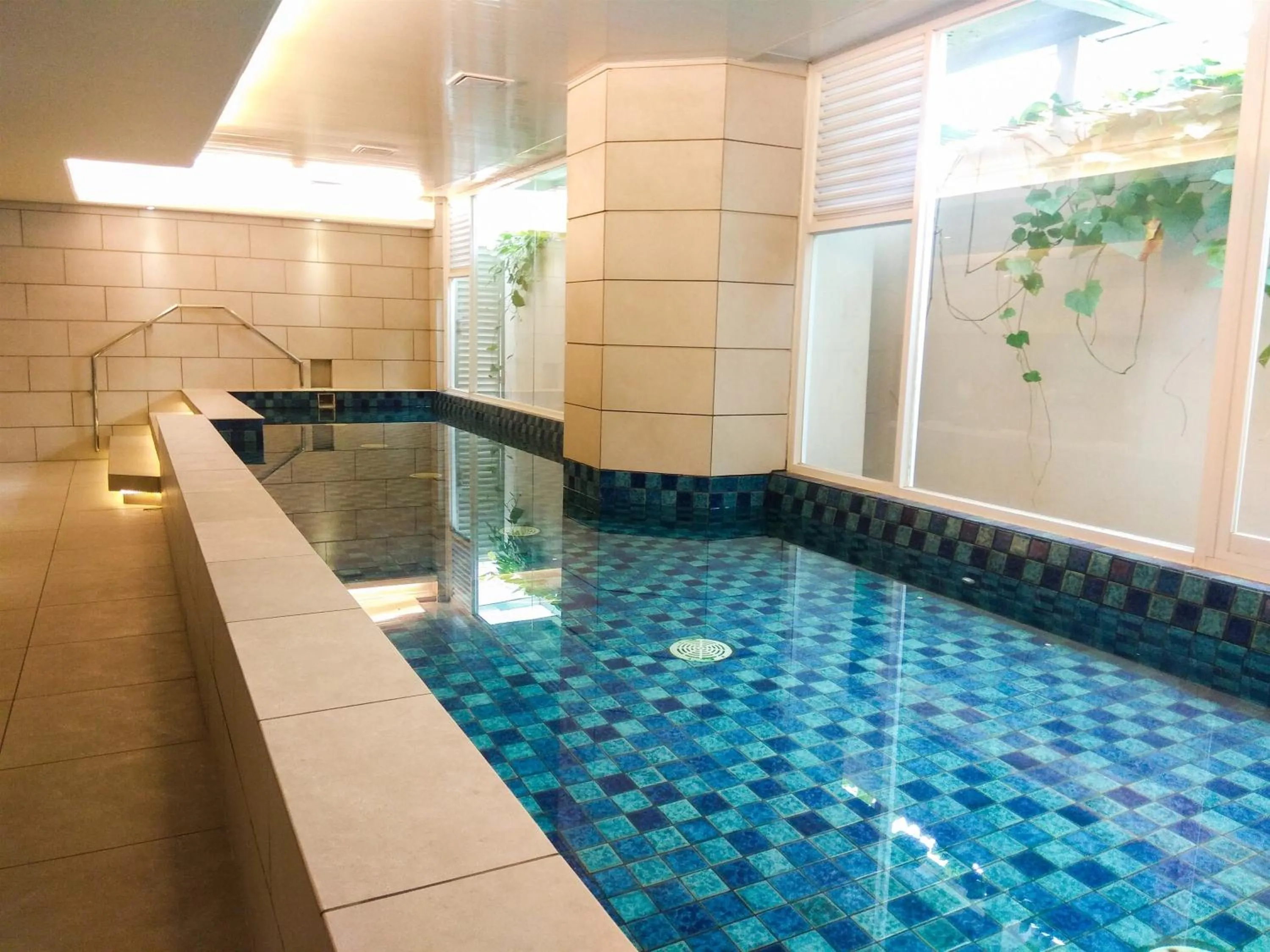 Swimming pool in Modern Apartment Studio No Kitchen Mustika Golf Residence By Travelio