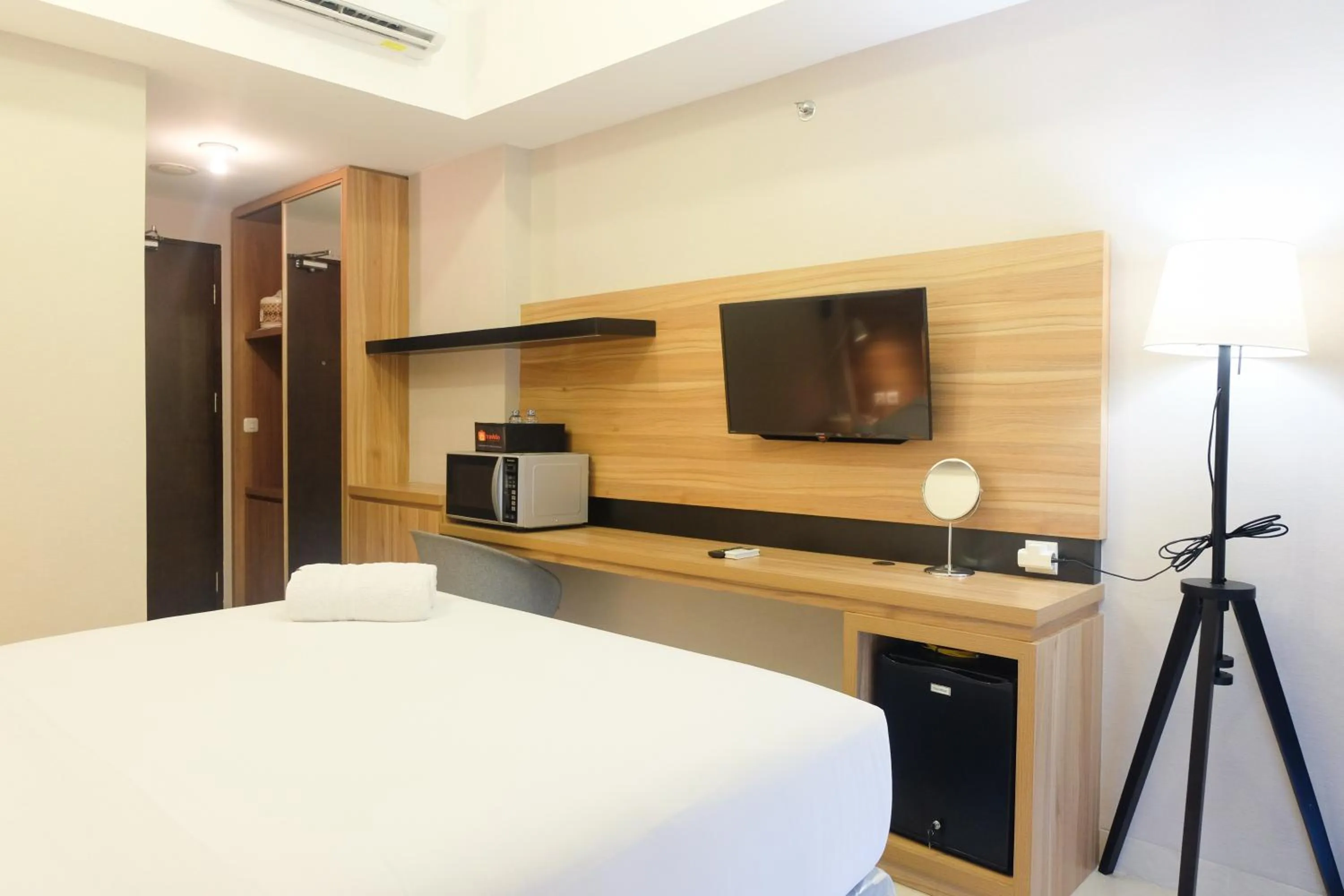 Bed in Modern Apartment Studio No Kitchen Mustika Golf Residence By Travelio