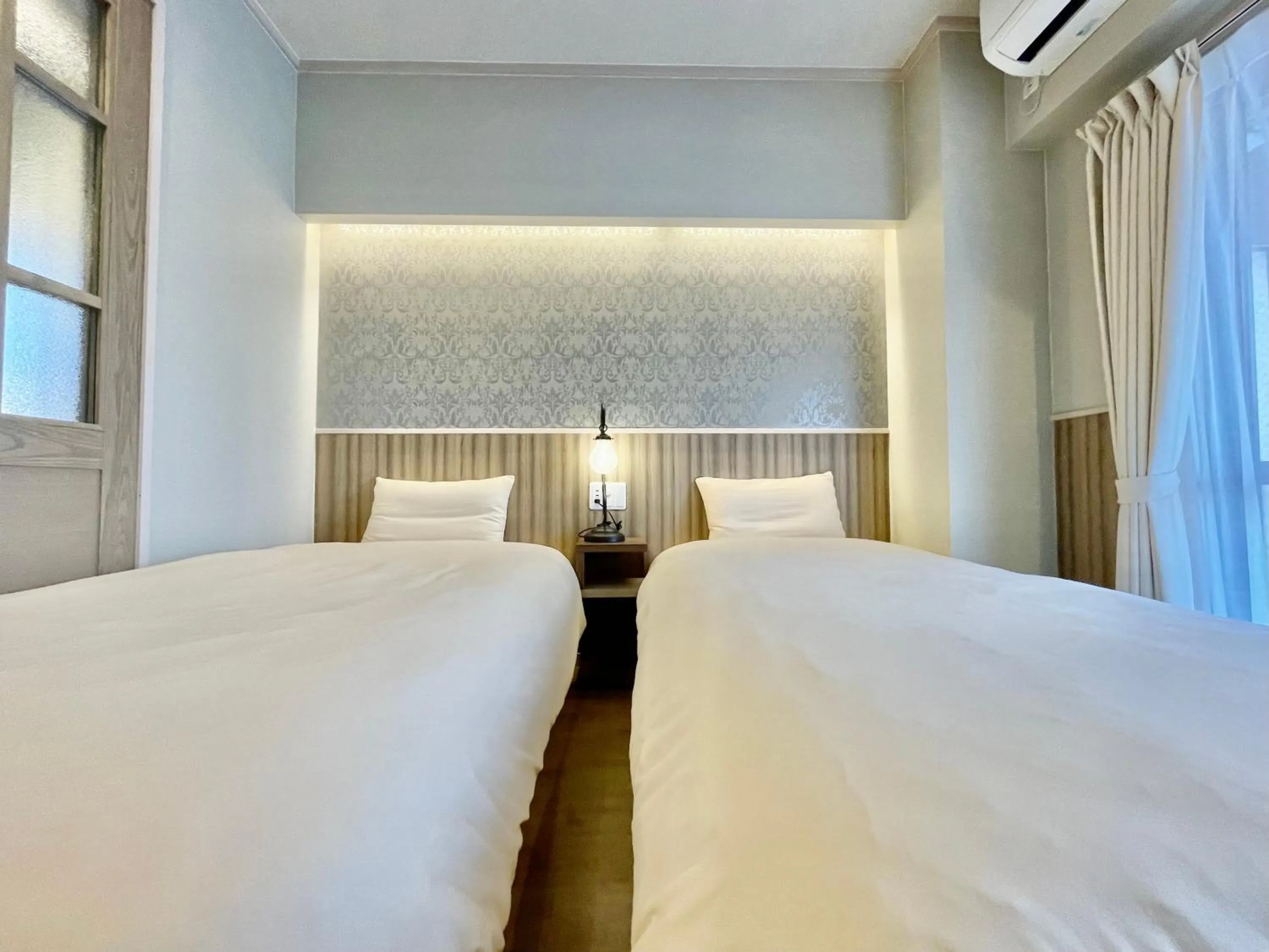 Bed in ホテル天使館 久茂地 -Tenshi-Kan-