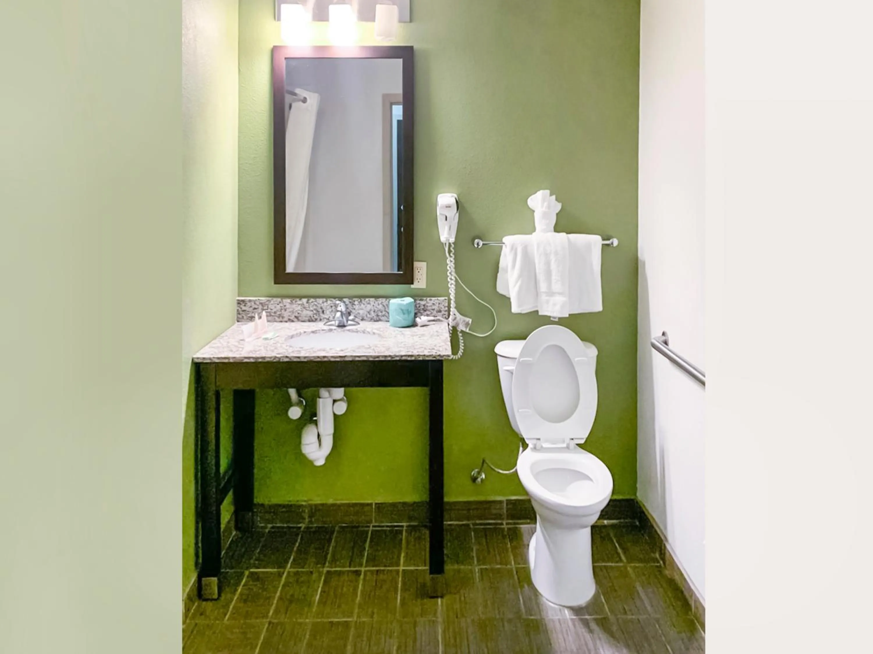 Bathroom in Ramada by Wyndham Jackson MS