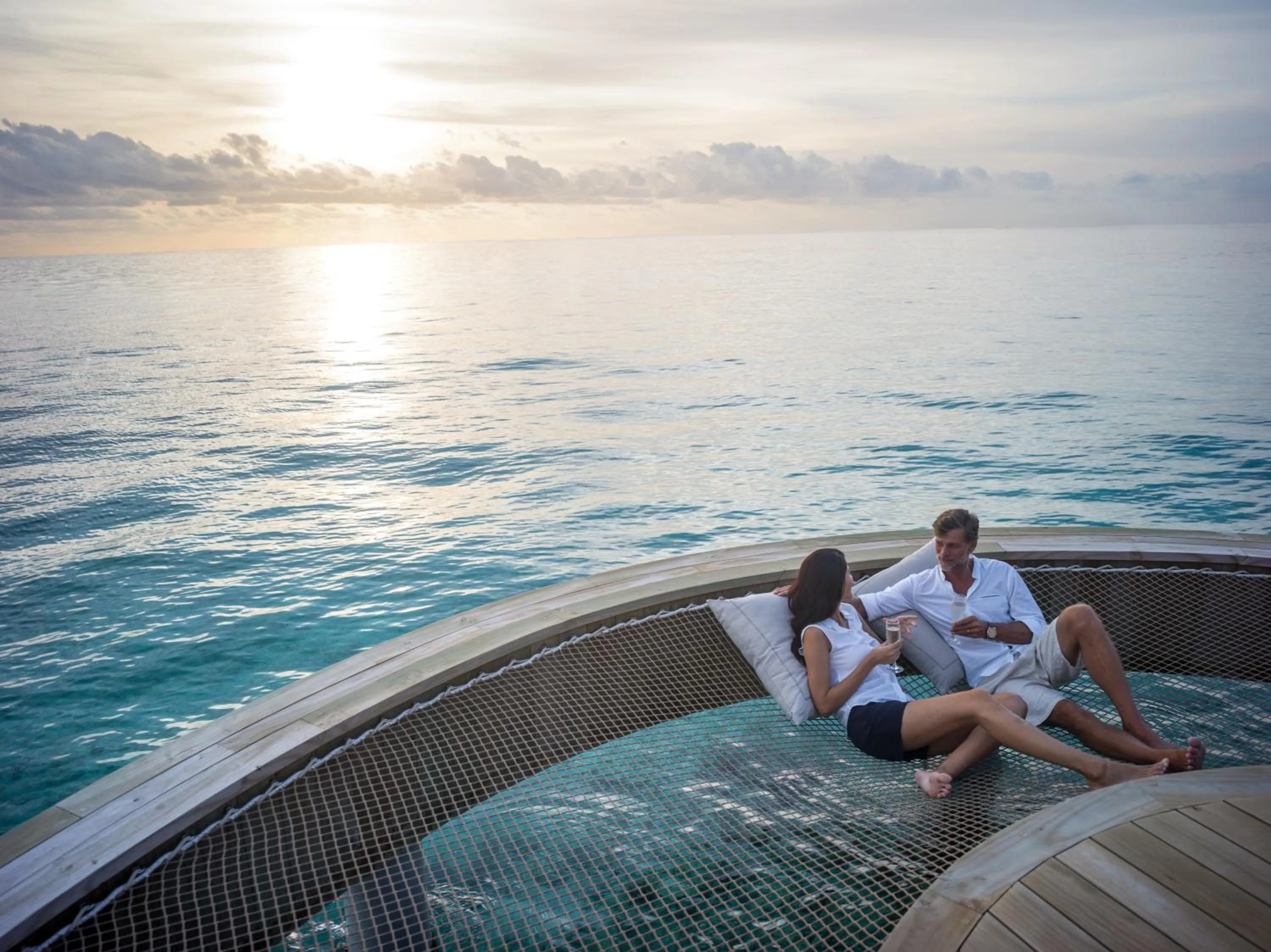 Guests in Intercontinental Maldives Maamunagau Resort with Club benefits by IHG