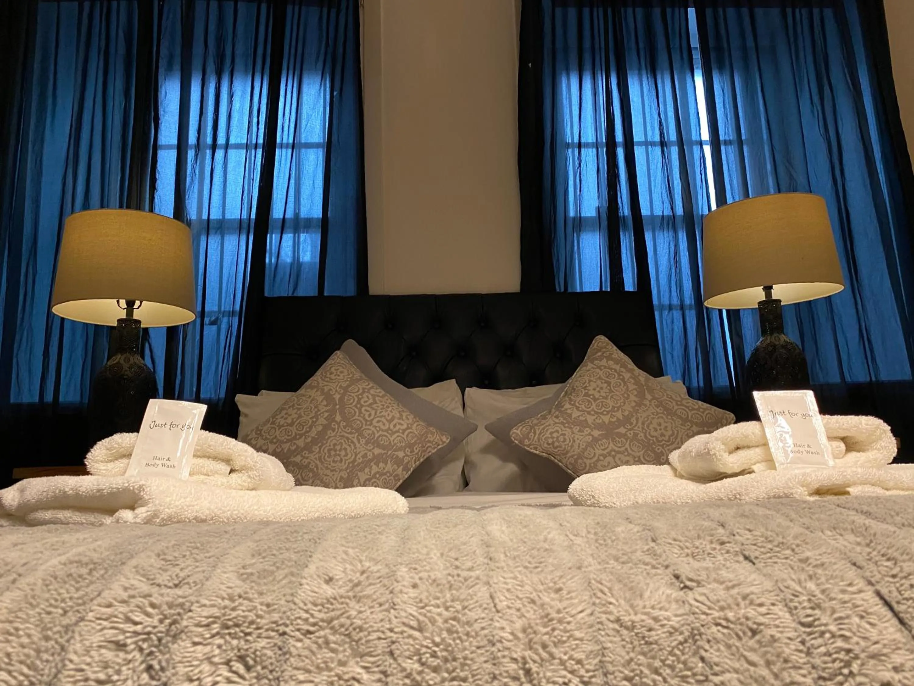 Bed in Queen Street Boutique Suites