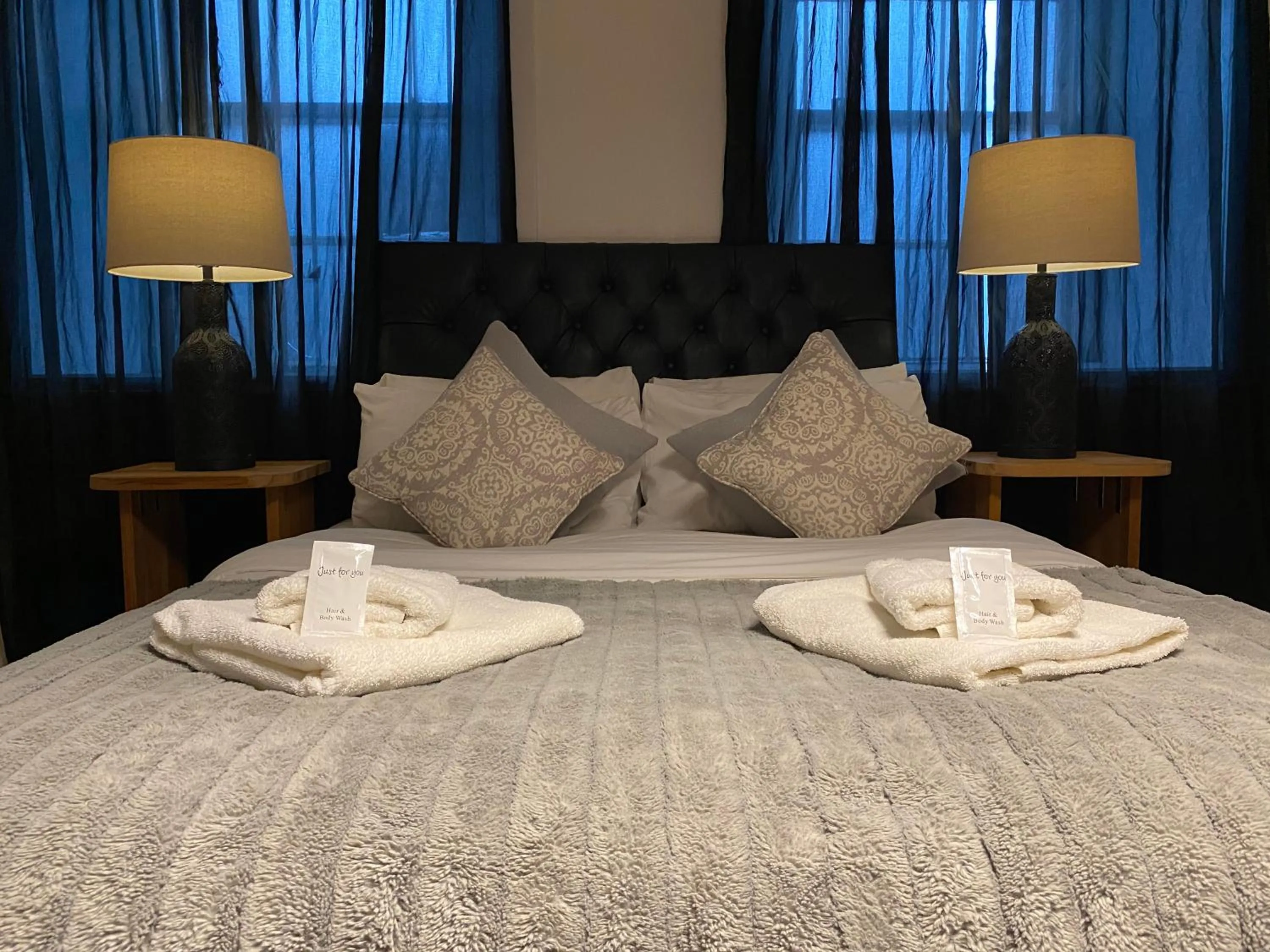 Bed in Queen Street Boutique Suites