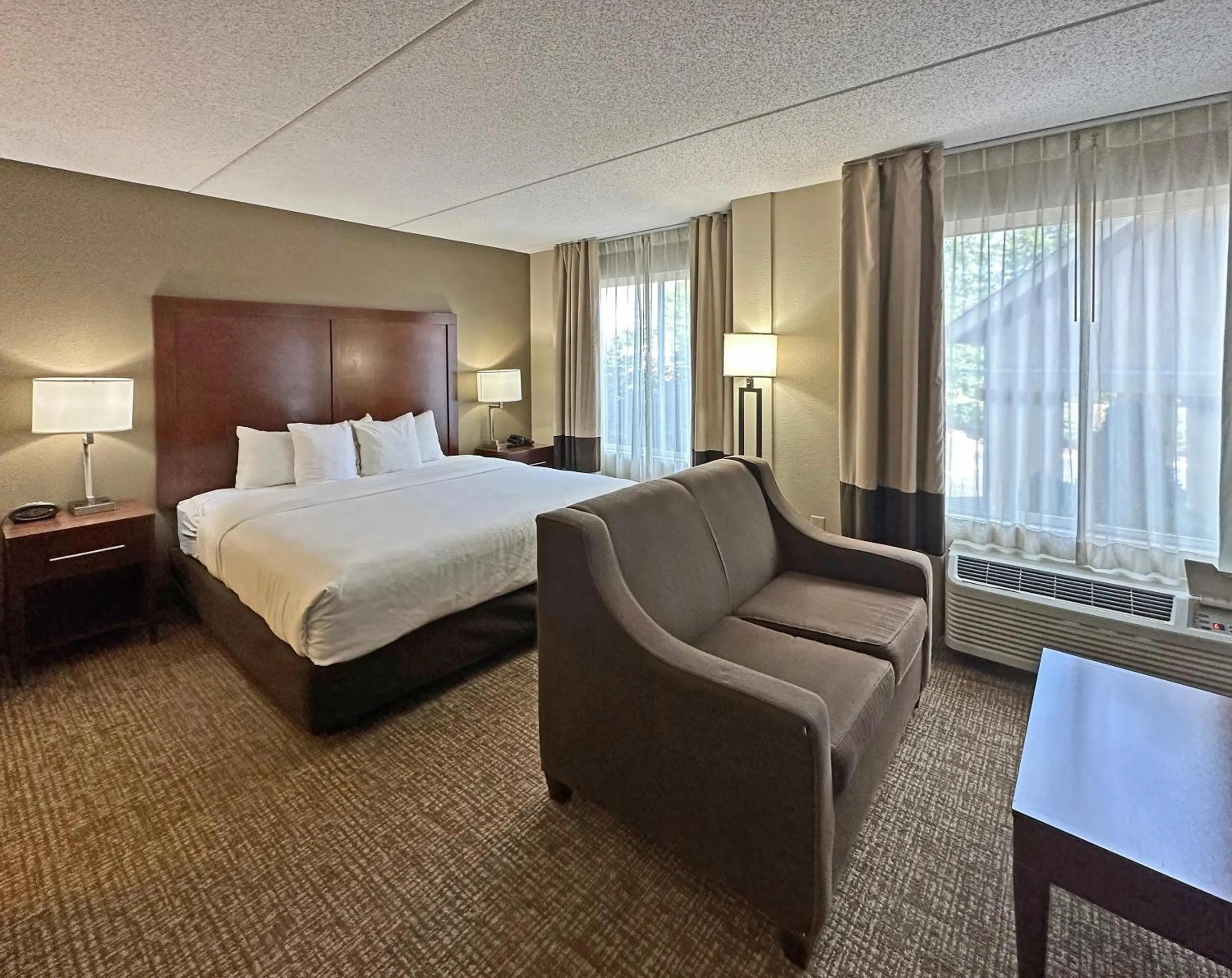 Bedroom, Bed in Concord Suites by IHG