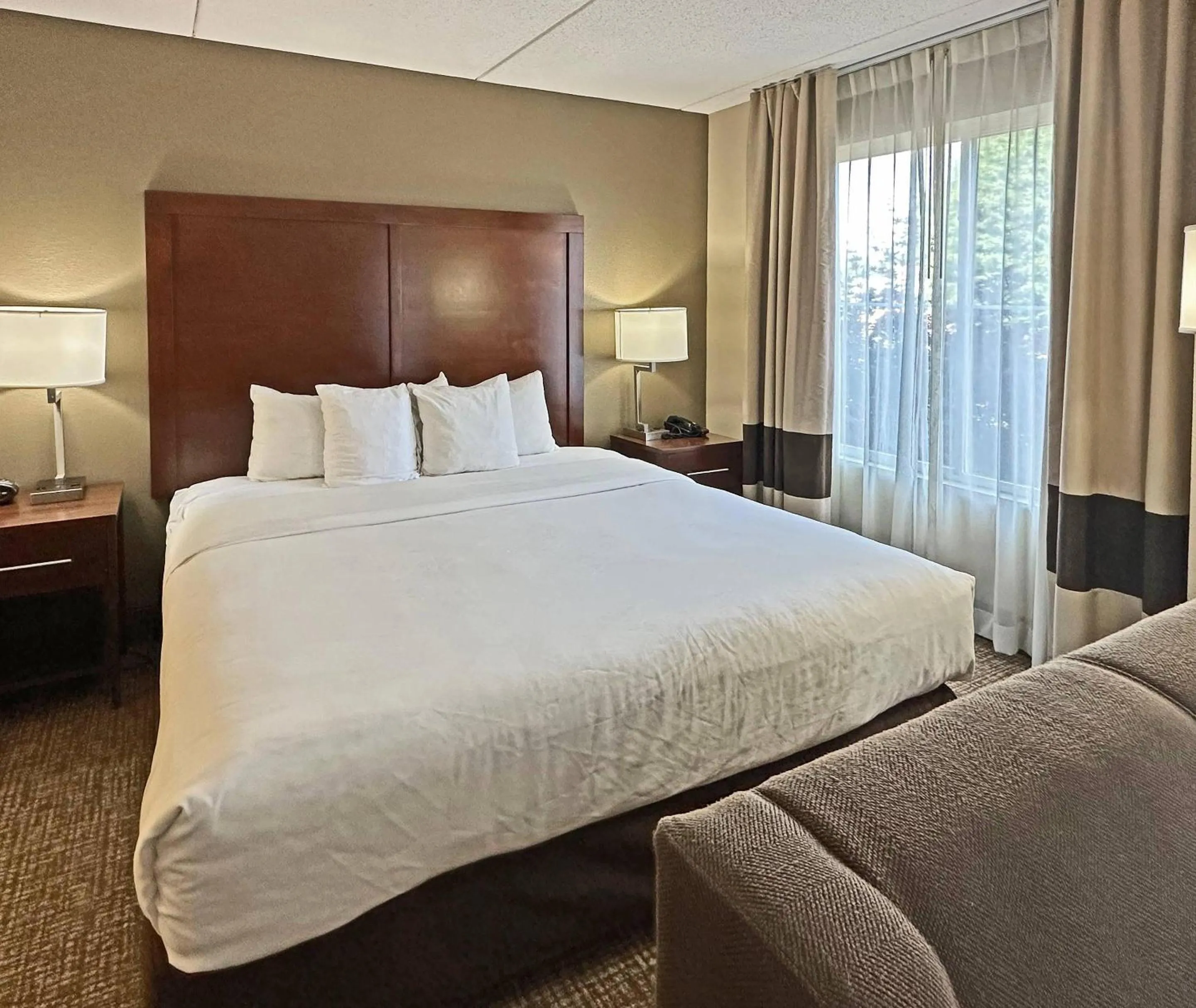 Bedroom, Bed in Concord Suites by IHG