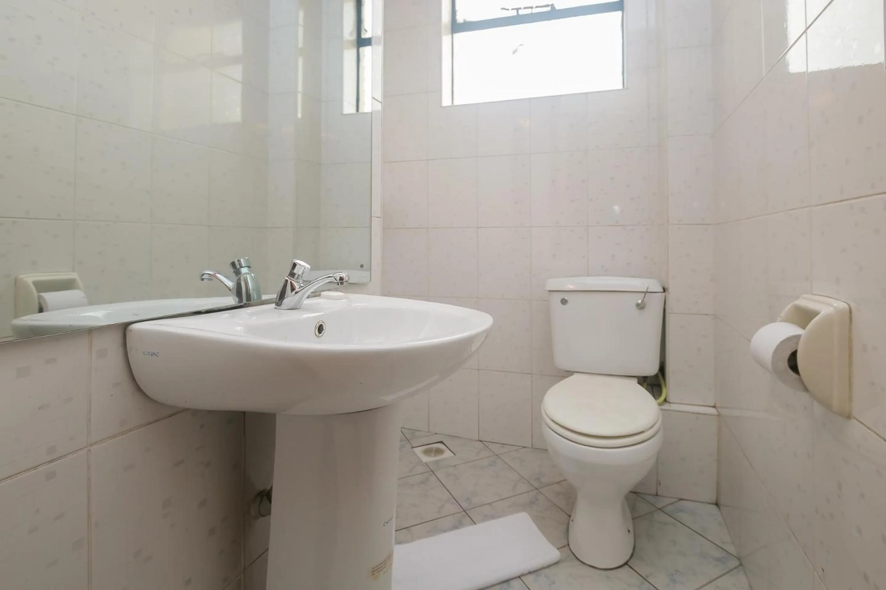 Toilet in Plus254 Hotel