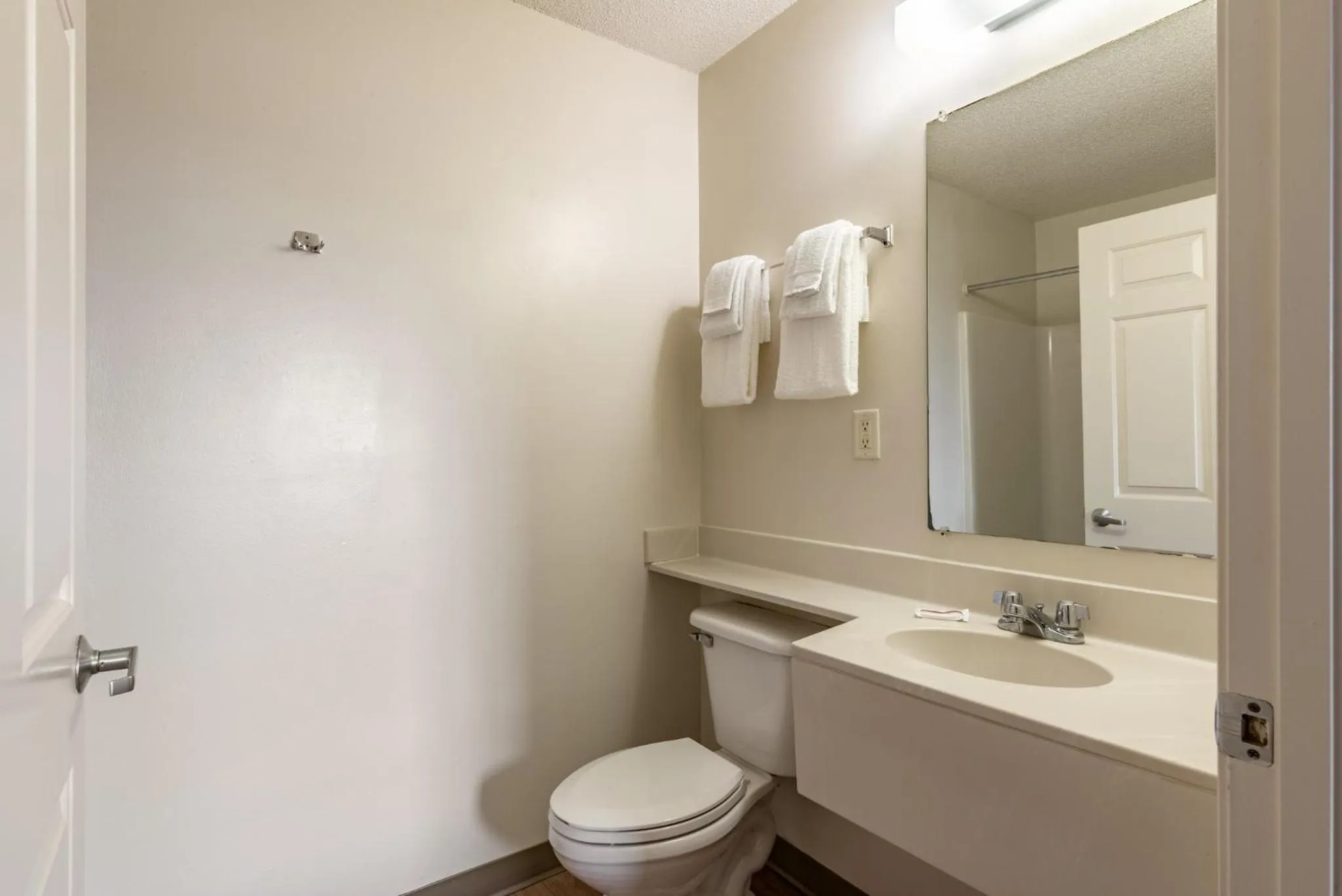Bathroom in HomeTowne Studios & Suites by Red Roof Charlotte - Concord