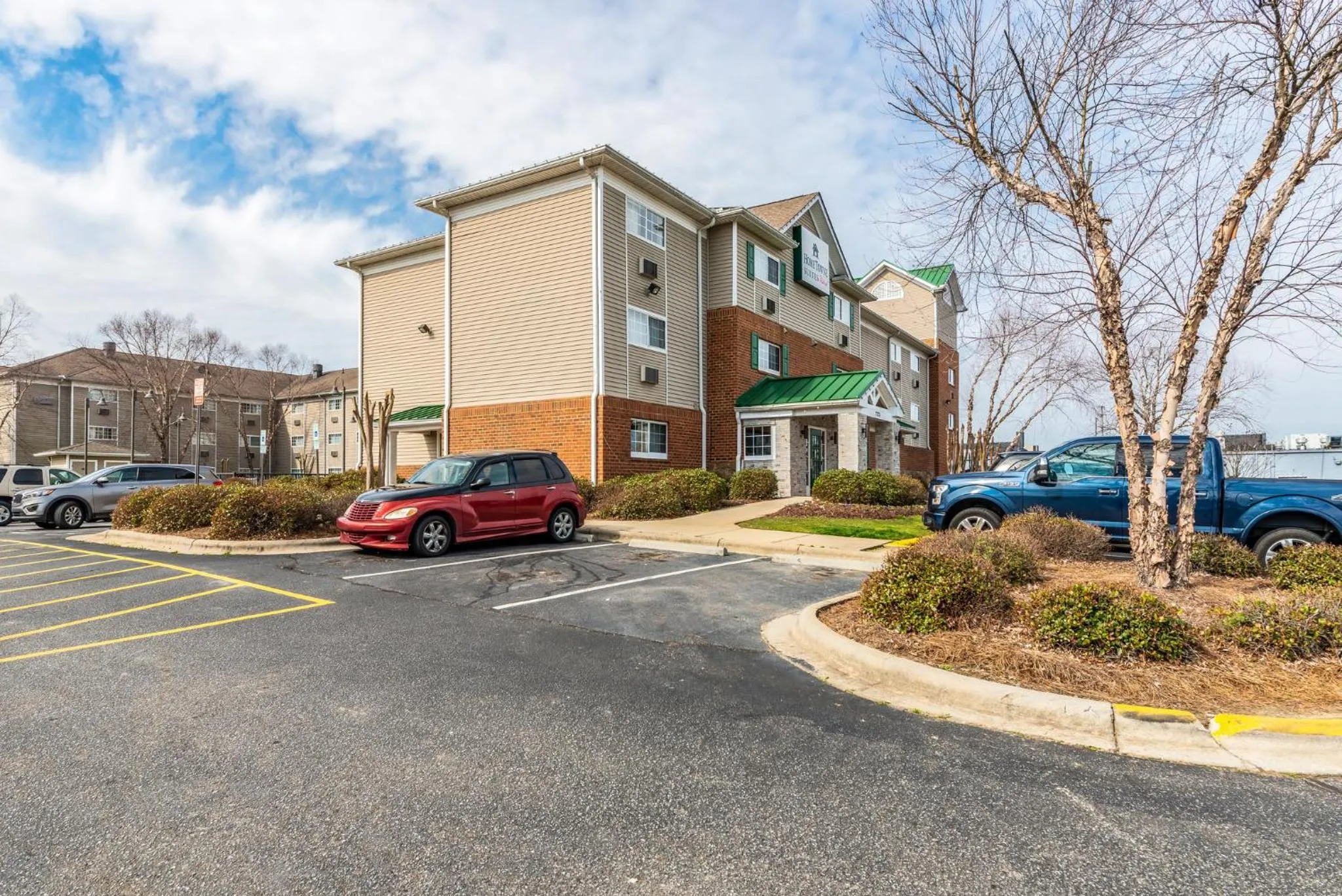 Property building in HomeTowne Studios & Suites by Red Roof Charlotte - Concord