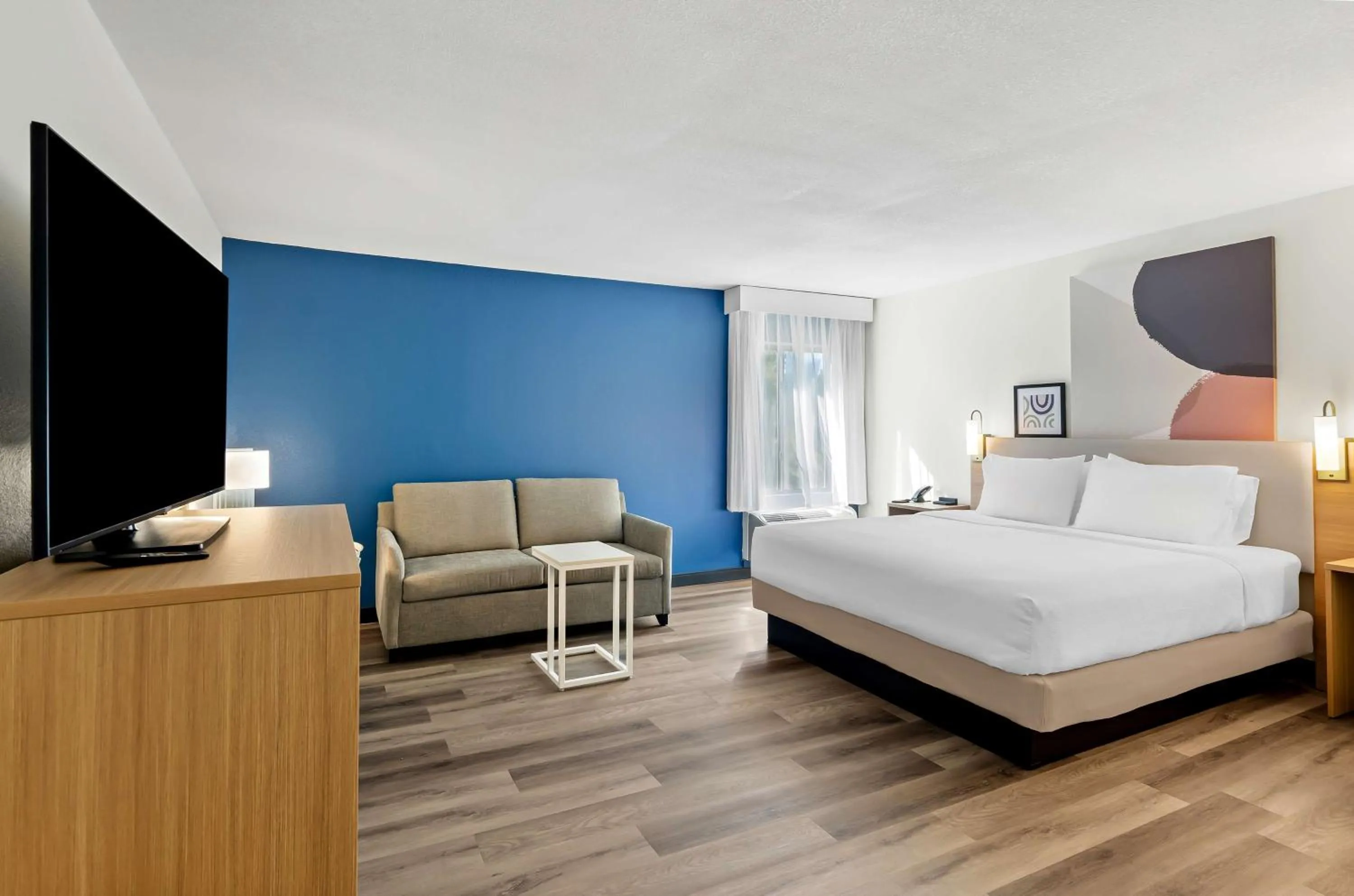 Living room, Bed in Spark by Hilton Winston-Salem University