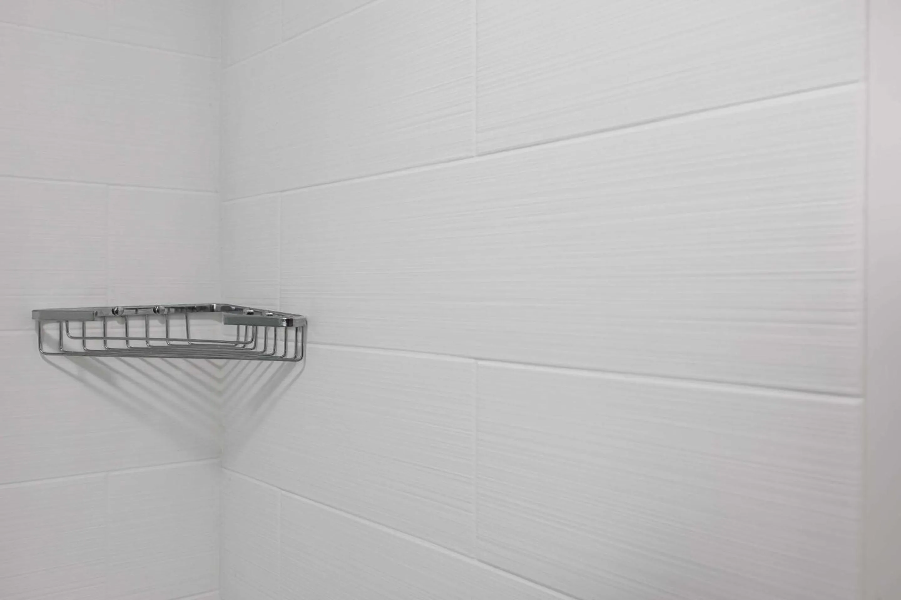 Bedroom in Rodeway Inn & Suites near Outlet Mall - Asheville